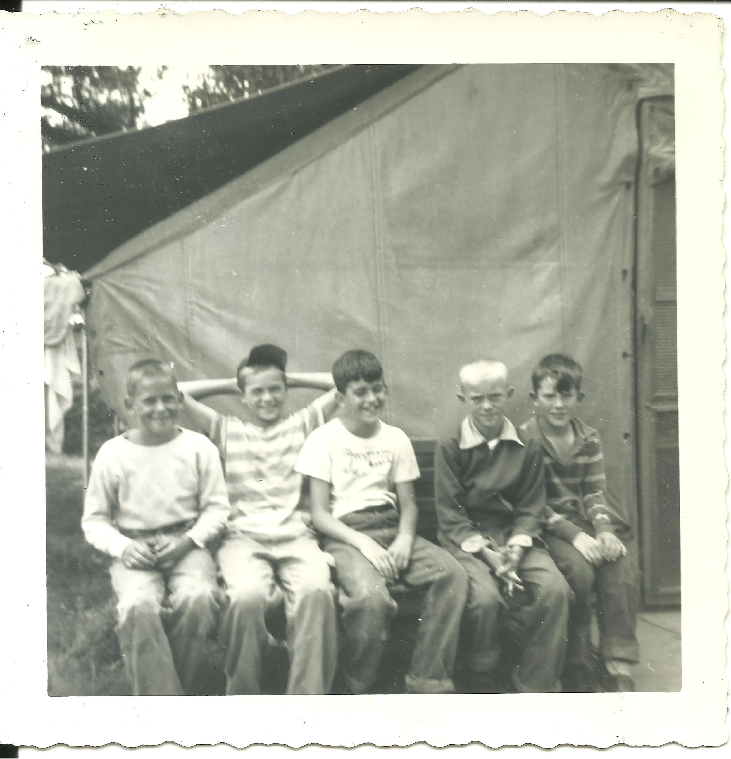 1960s - Campers sitting outside of their tent