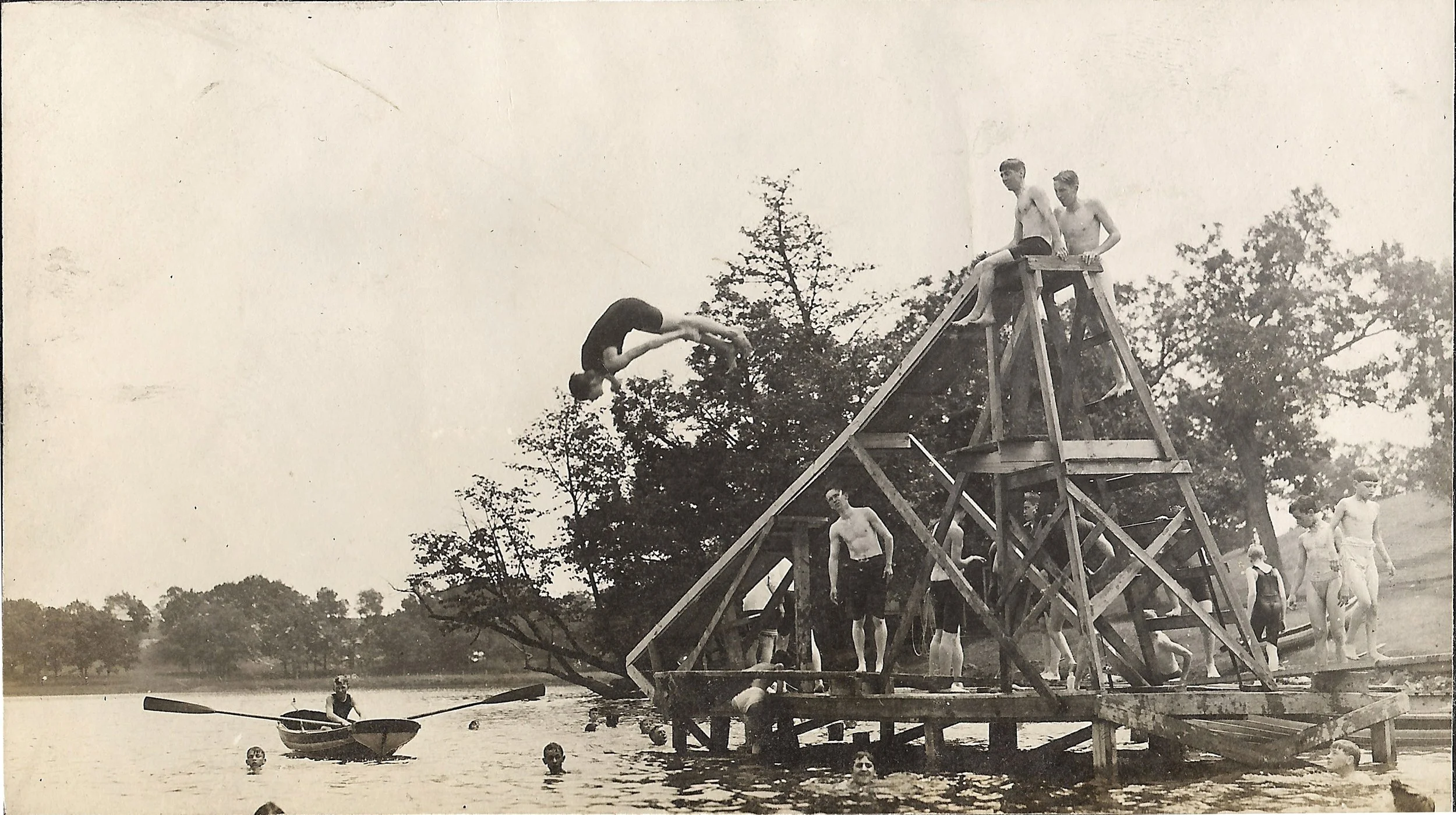 1900s - Camper diving off of the diving platform at the swimming area