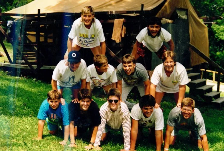 2004 - Campers make a pyramid outside of the tents
