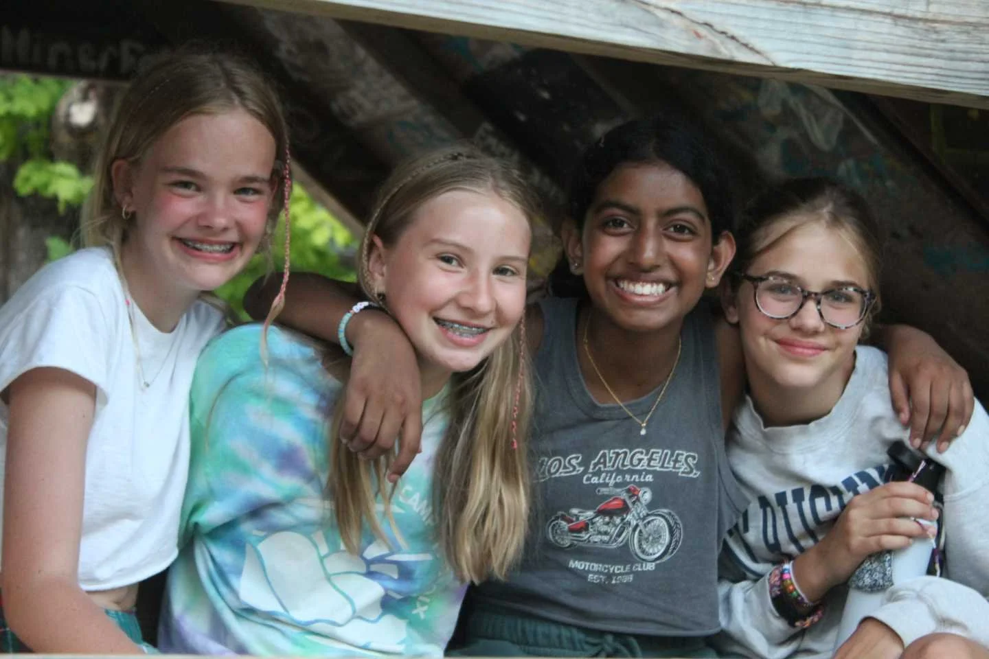 4 girls in girl scout tent.jpeg