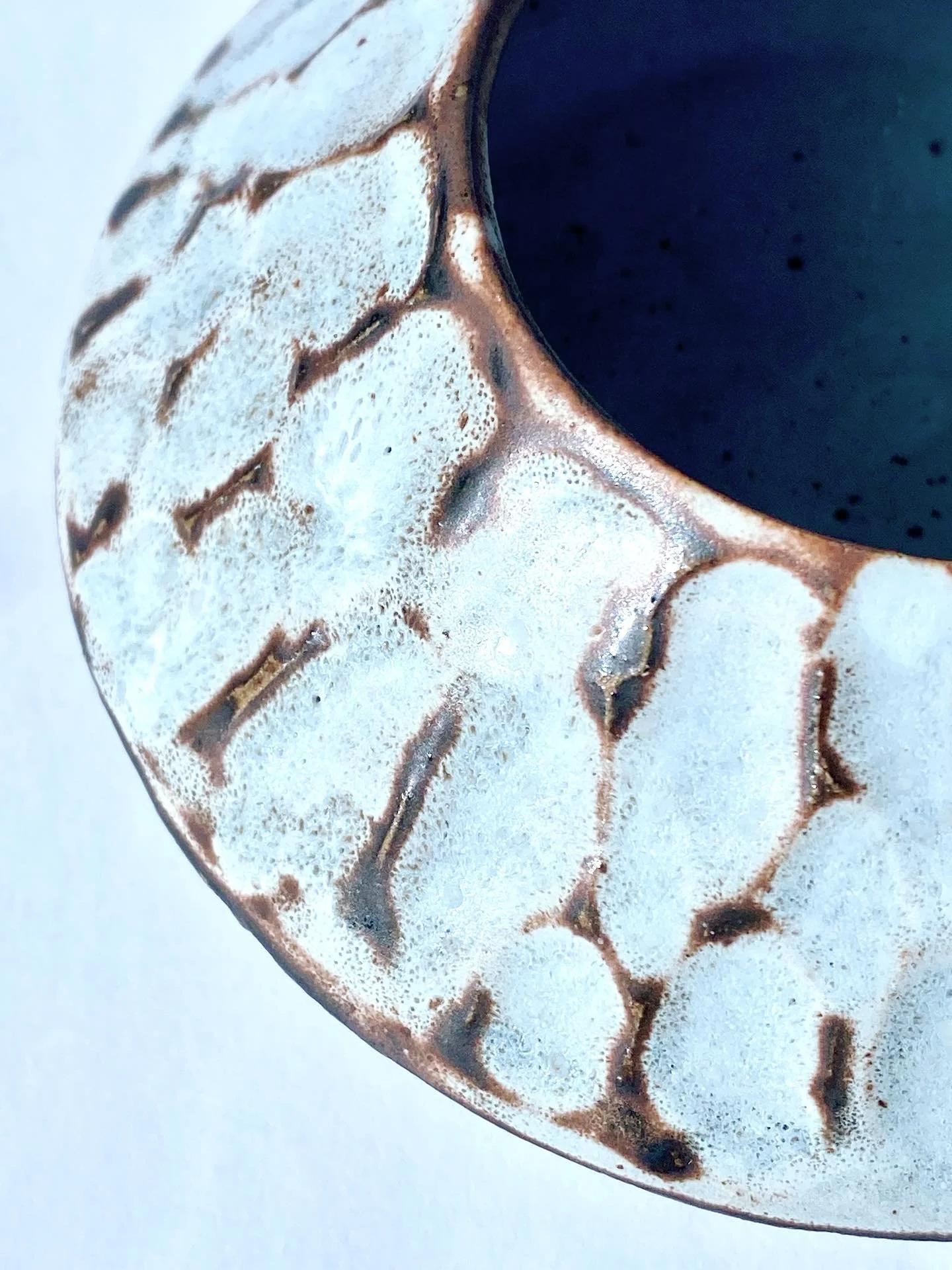 Shino glaze over matte dark blue