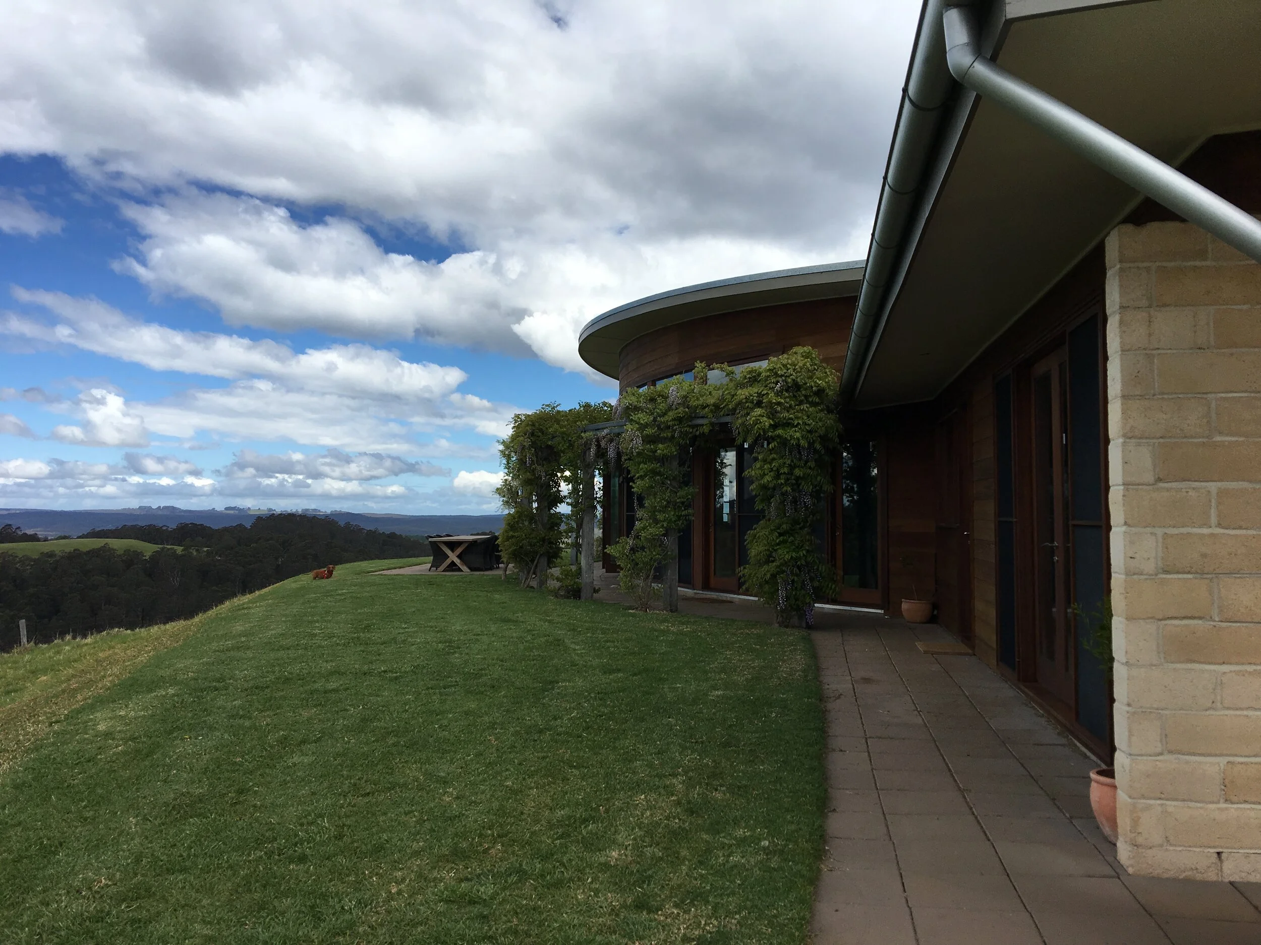wrap around glazed doors to curved living area
