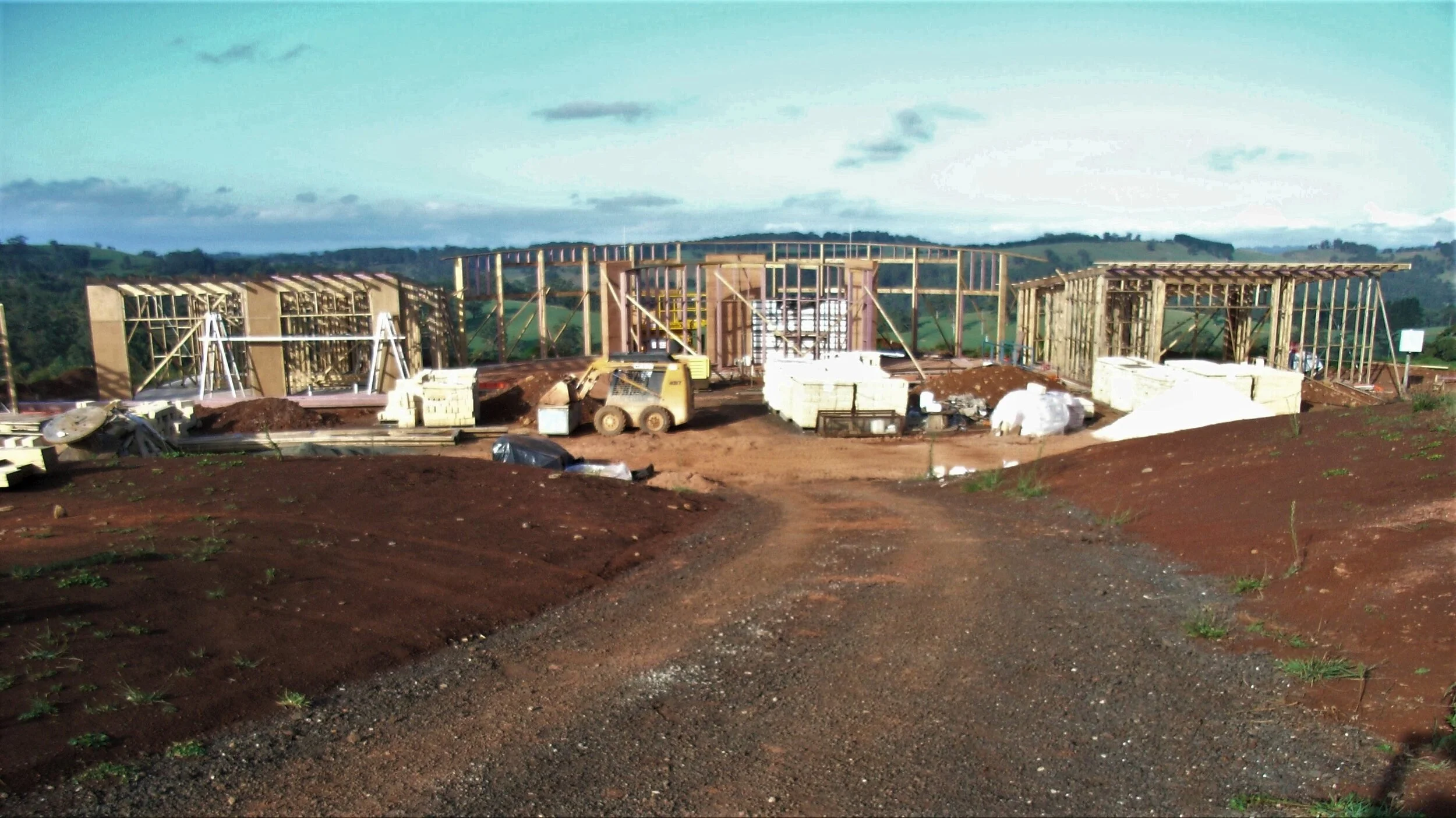 in progress showing framing & rammed earth walls