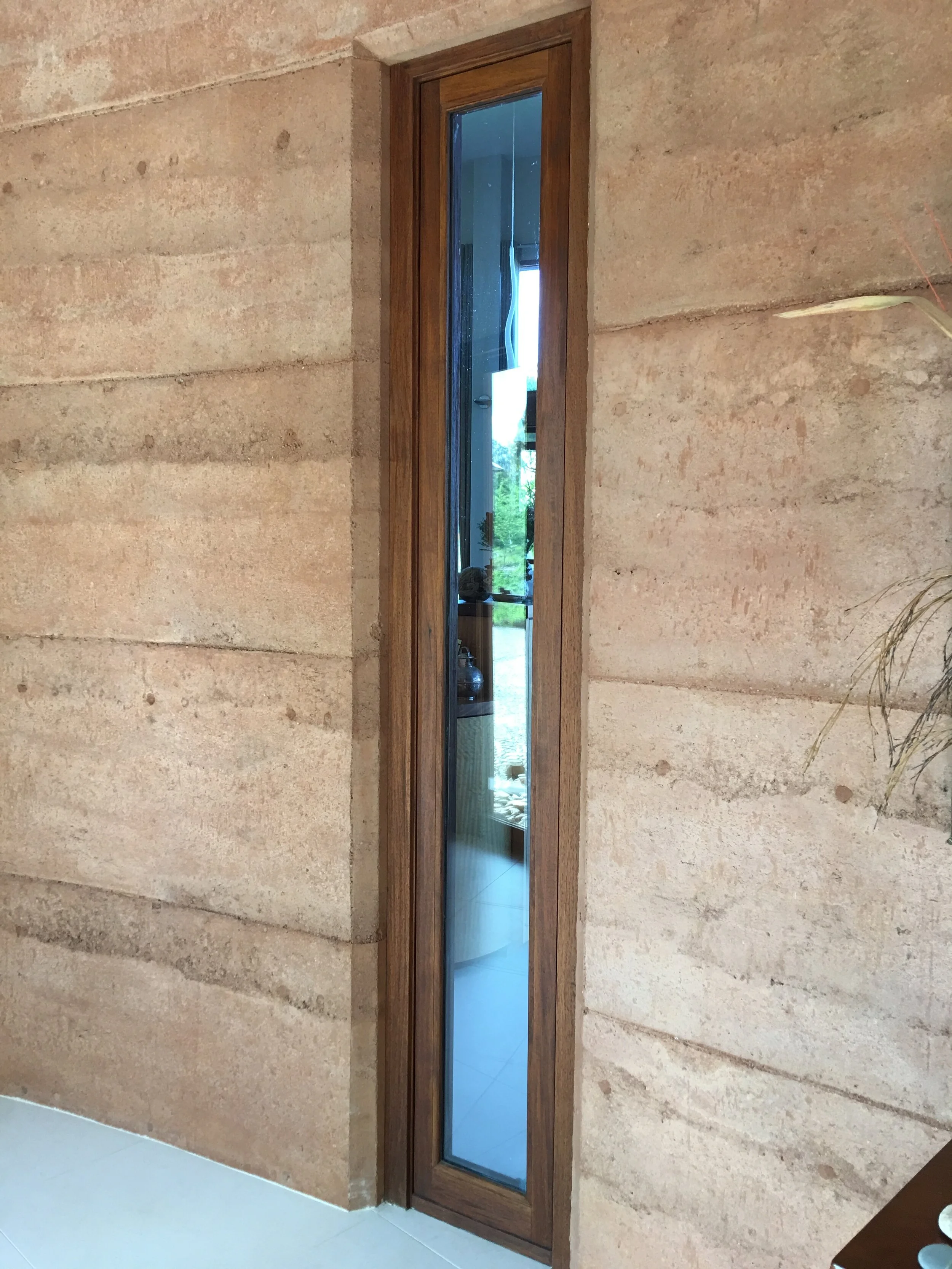 narrow window offering a vingette of the view beyond