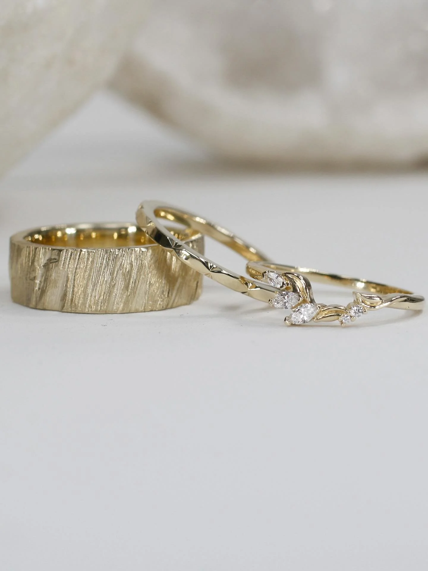 A perfect match in yellow gold to seal the deal at their recent nuptials. For his wedding ring he chose our 6mm etched Staffa band, while she went for a perfectly balanced pair of bands to frame her Brazen engagement ring. Swipe to see her full stack