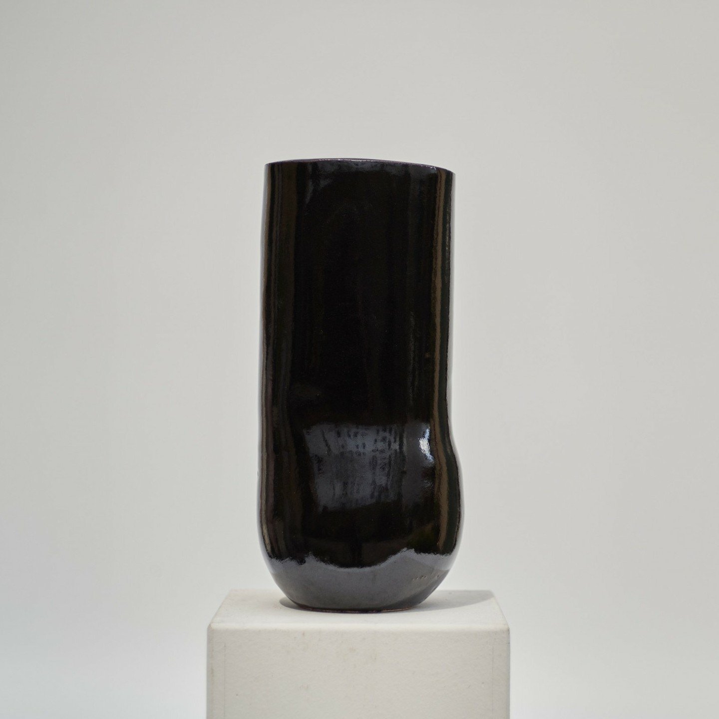 This vase holds a glaze that no photo can truly capture. What looks like black is actually a rich Tenmoku dark brown, alive with warmth, catching the light in ways that shift with every glance. I&rsquo;ve searched for a brown like this&mdash;deep, st