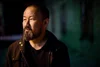 portrait of Chiwan Choi outside at night wearing a black jacket