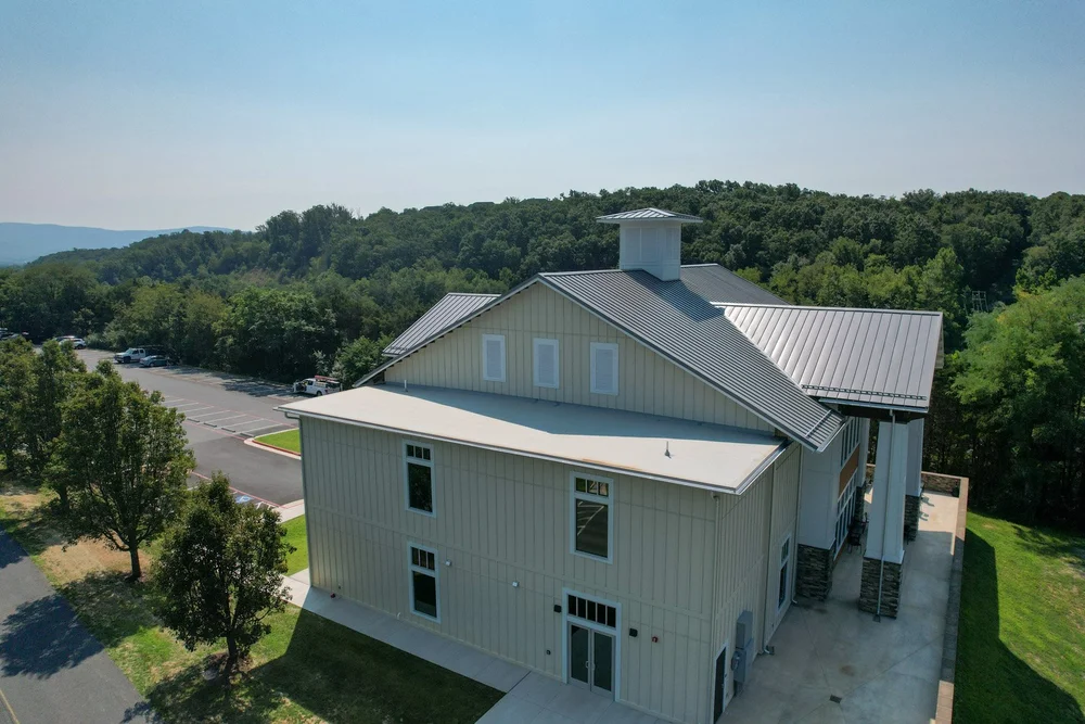 Rear aerial view of the completed new-construction roofing project in Massanutten, Virginia.