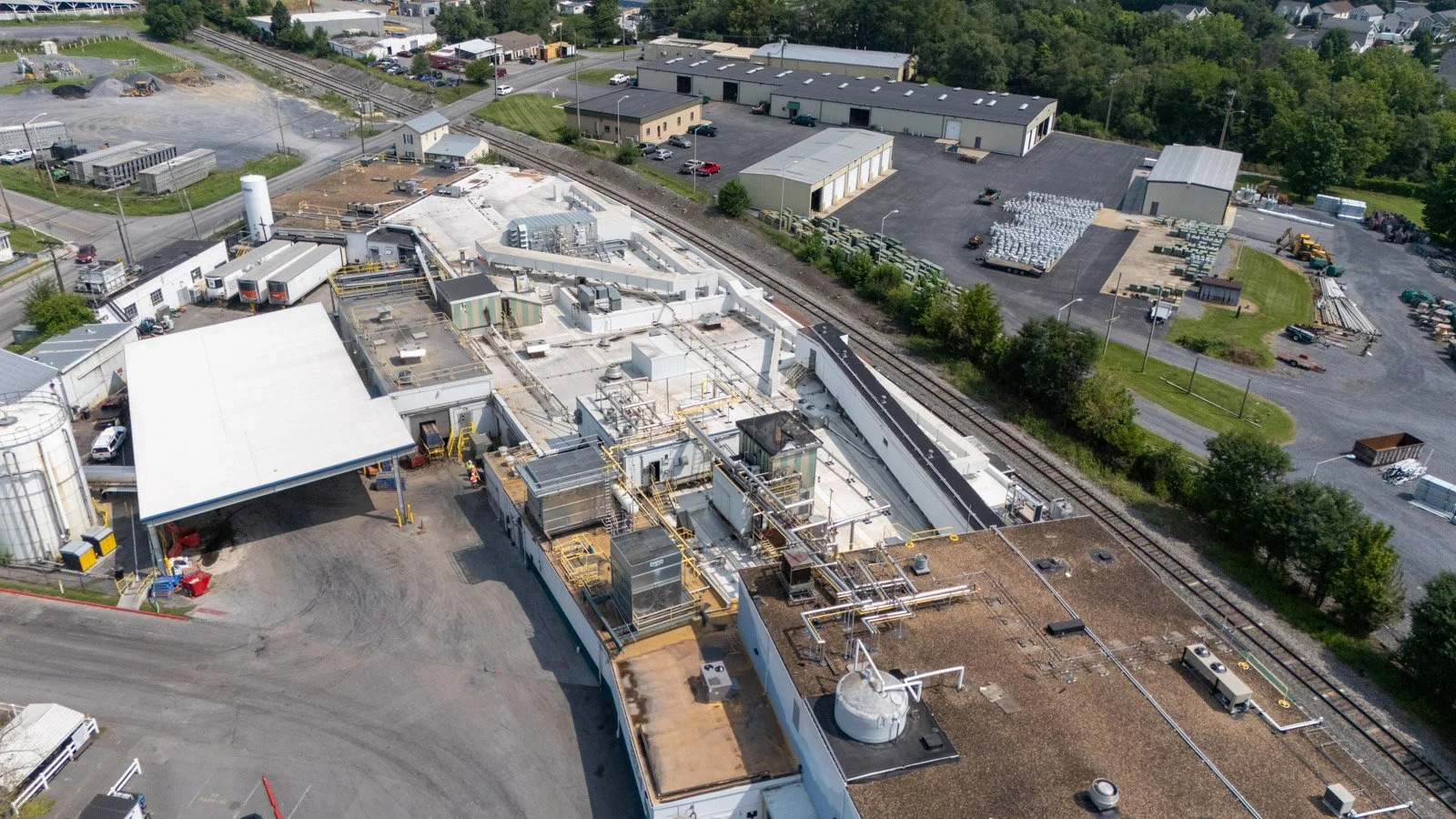 Drone view of the white TPO roofing system installed across the Farmer Focus industrial facility.