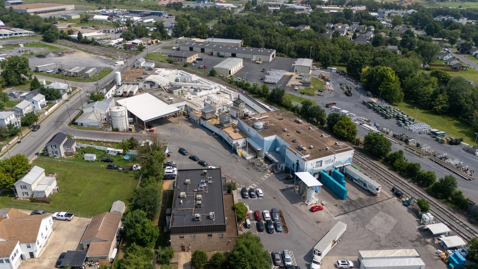 Wide aerial view of the Farmer Focus processing facility and surrounding industrial area.