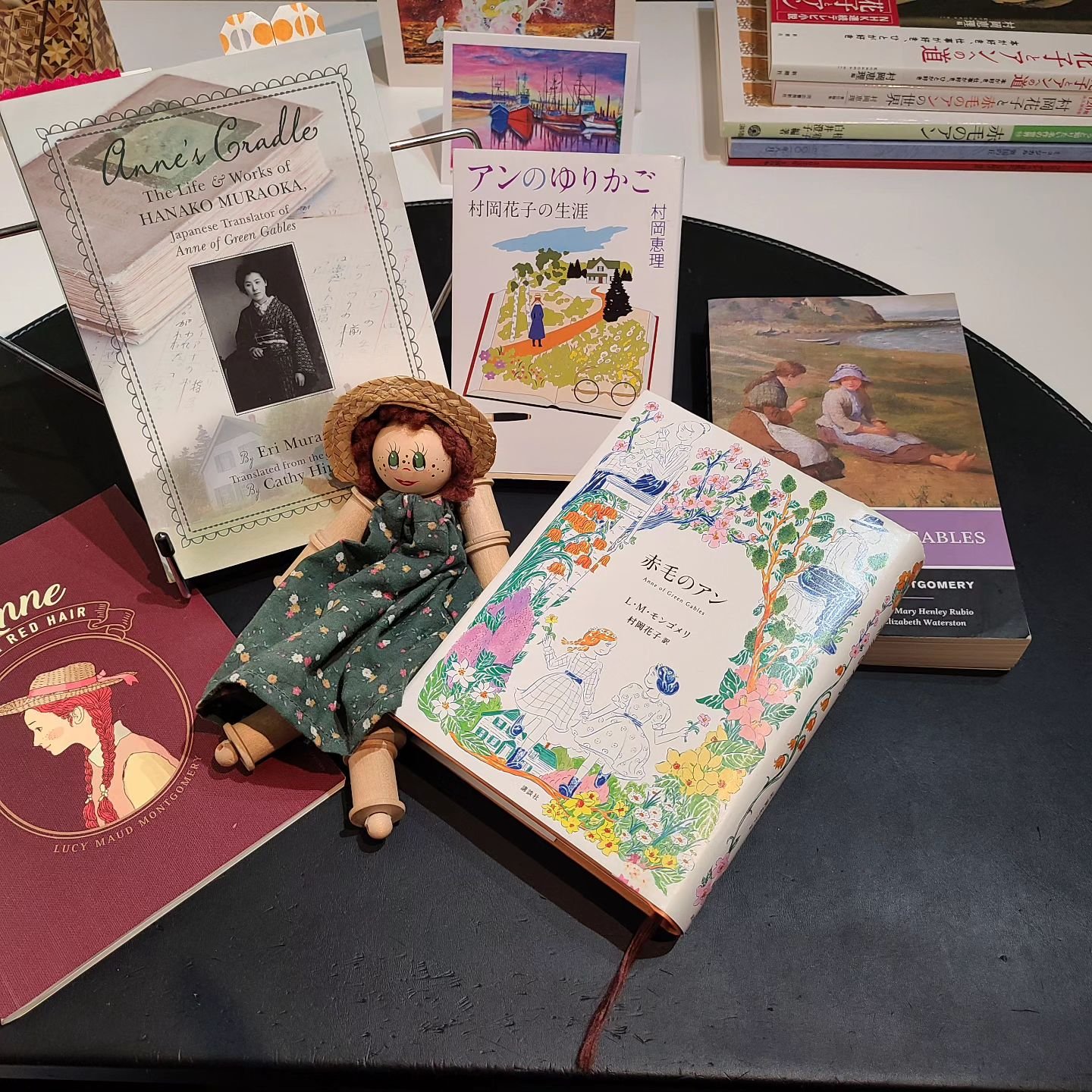 Sample from my joyfully cluttered writing desk ✨️ Close to 30 years ago, Mom brought me an Anne doll from Prince Edward Island which has been cheering me on as I start work on my first play commission. Beyond grateful to @confedcentre for this opport