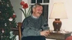 DENNIS HOLUB