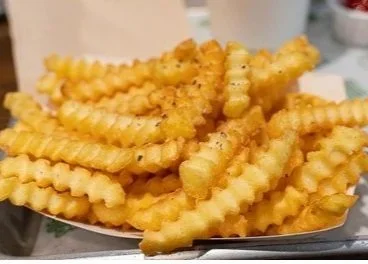 close-french-fries-260nw-1519693142.jpg