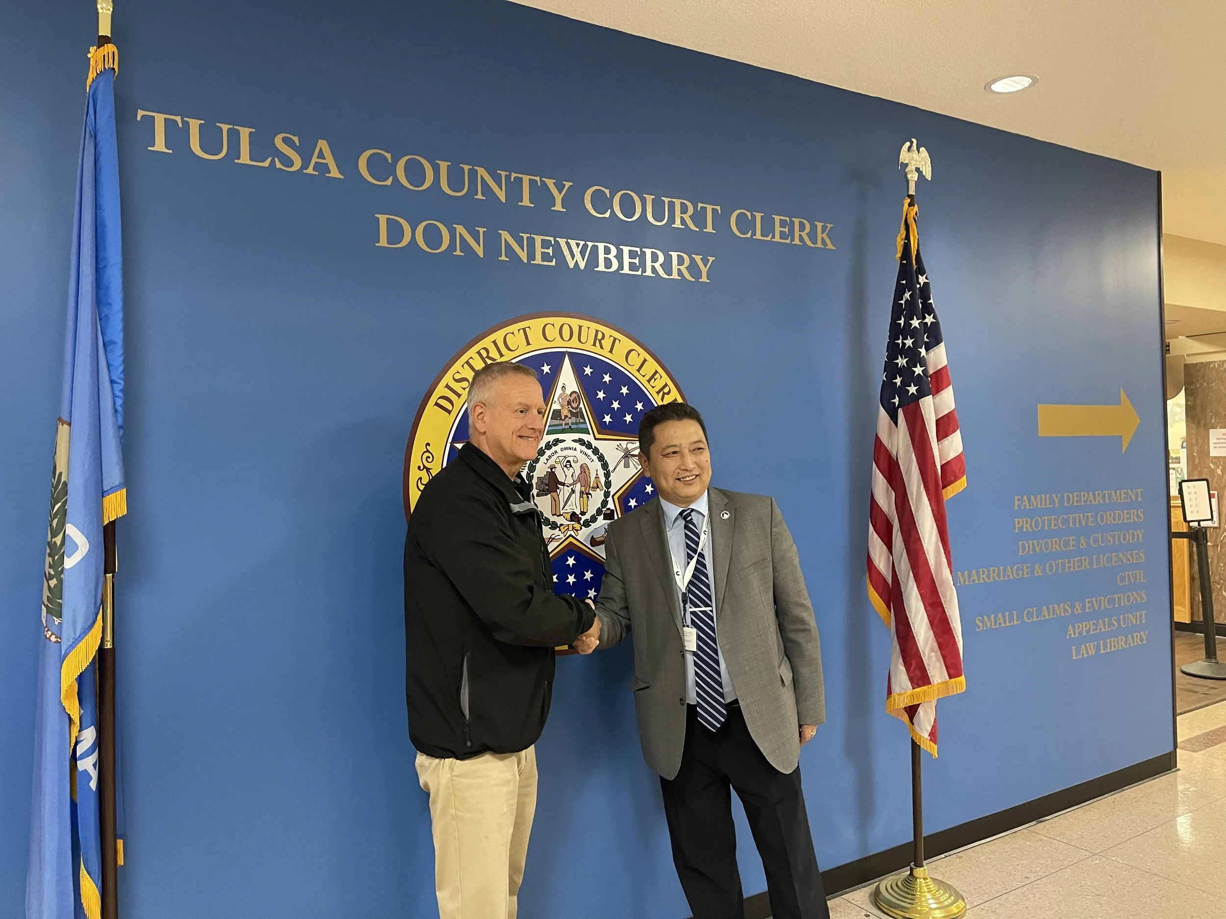 Chuluunbat Damdin with Tulsa County Court Clerk Don Newberry.jpeg