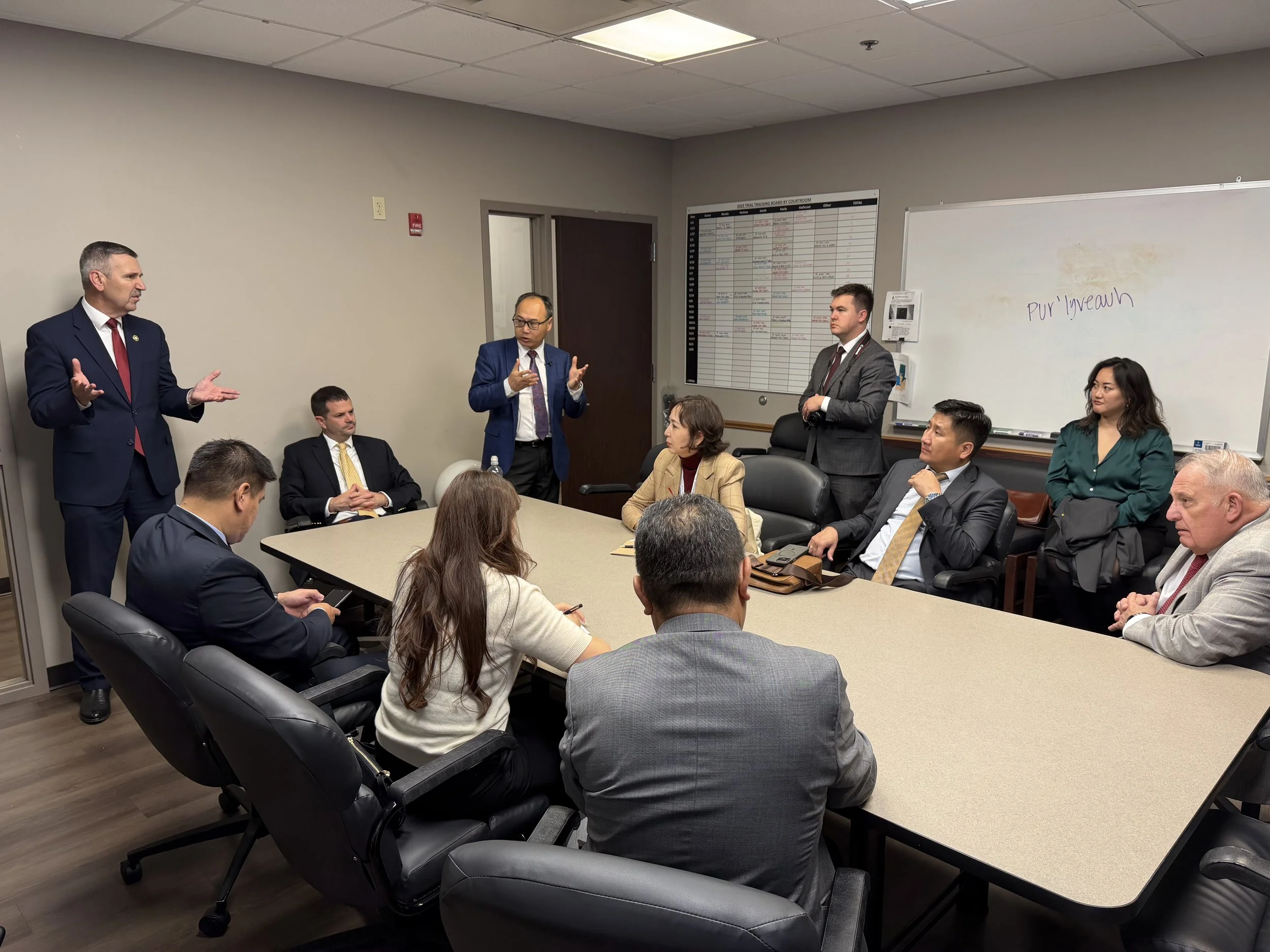Mongolian Prosecutors with Tulsa County DA Steve Kunzweiler Group discussion room.jpeg