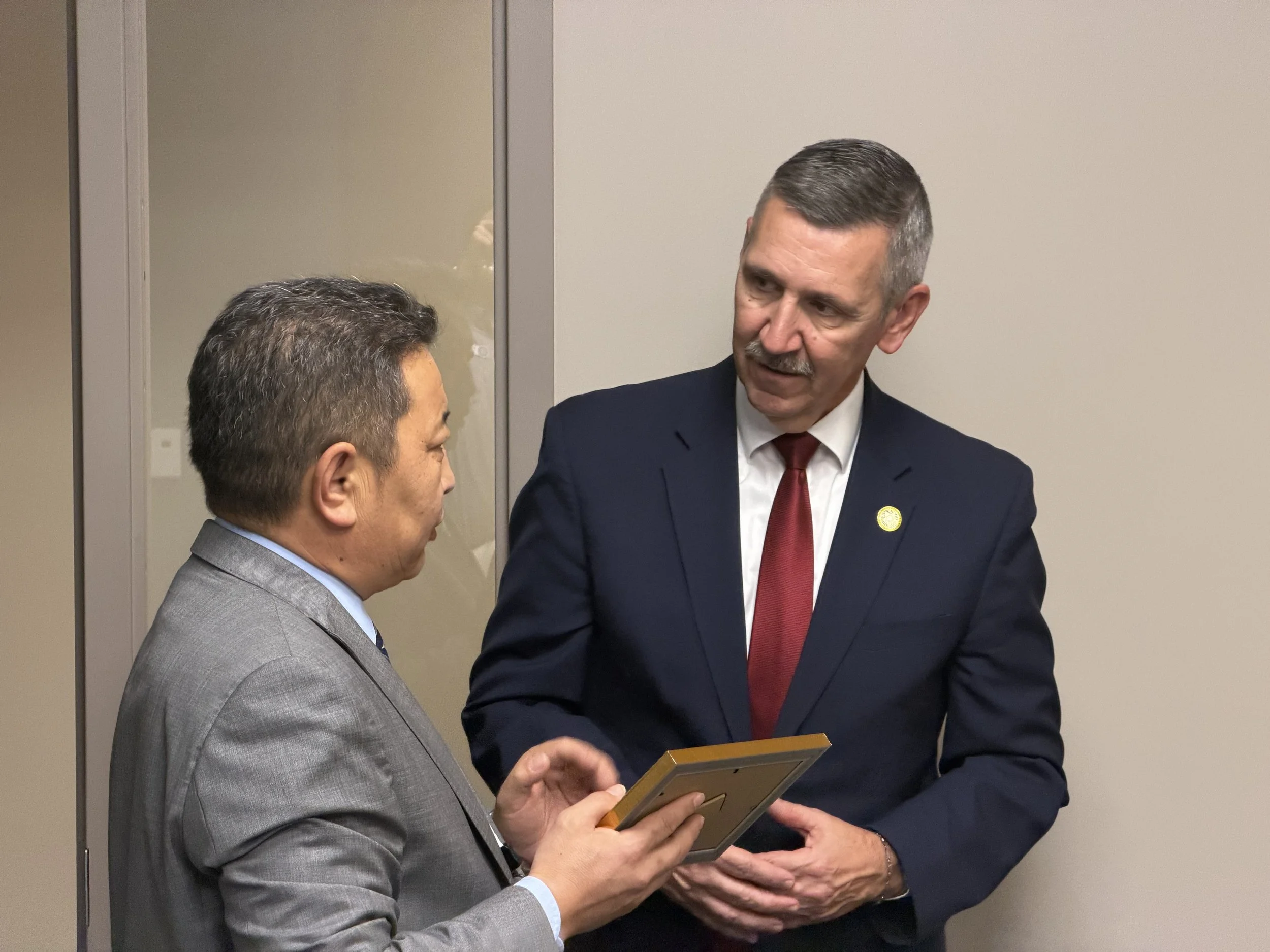 Mongolian Prosecutors with Tulsa County DA Steve Kunzweiler Gifts.jpeg