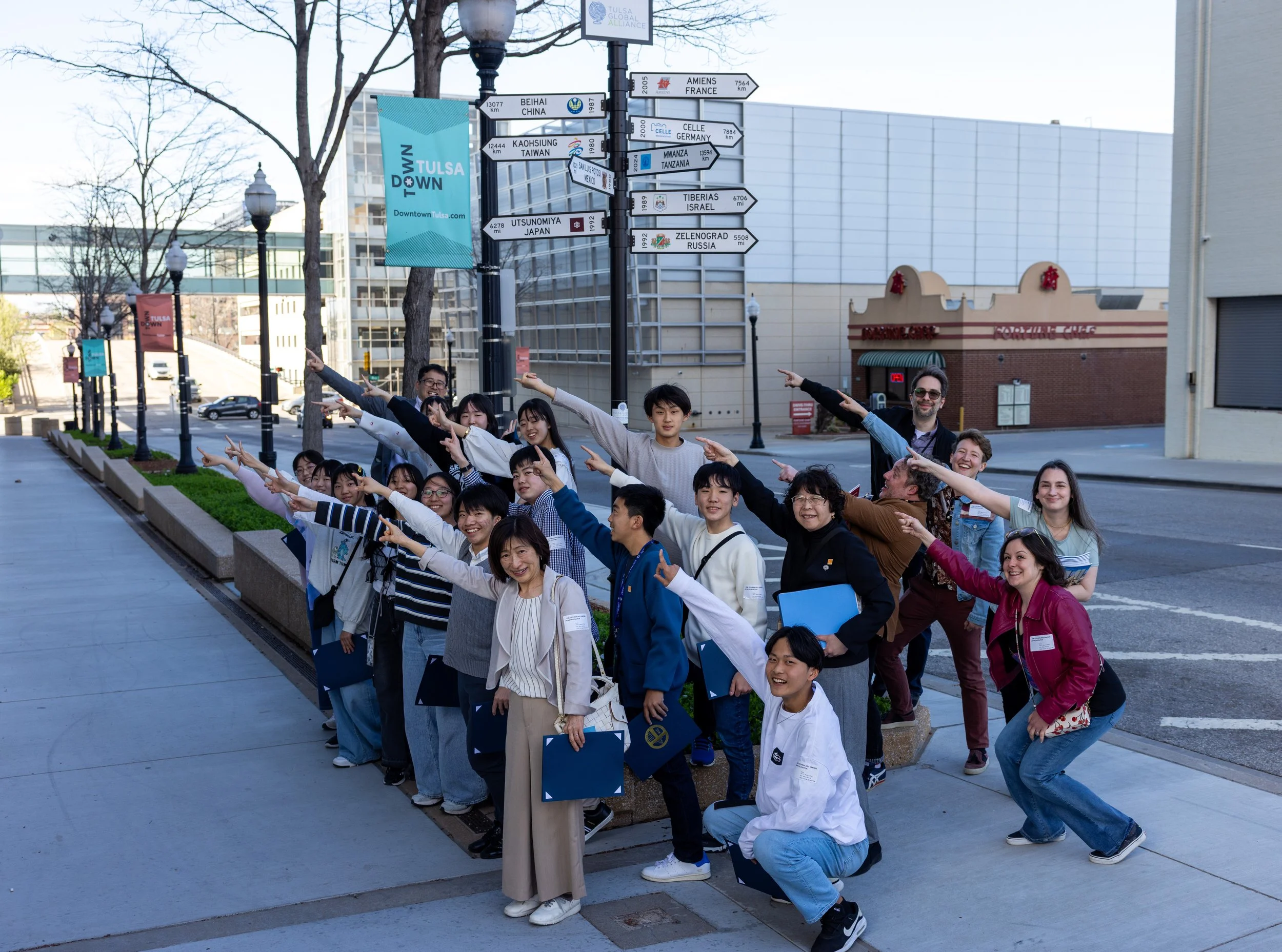 Utsunomiya Students in at Tulsa City Hall and TGA Sister City Sign.jpg