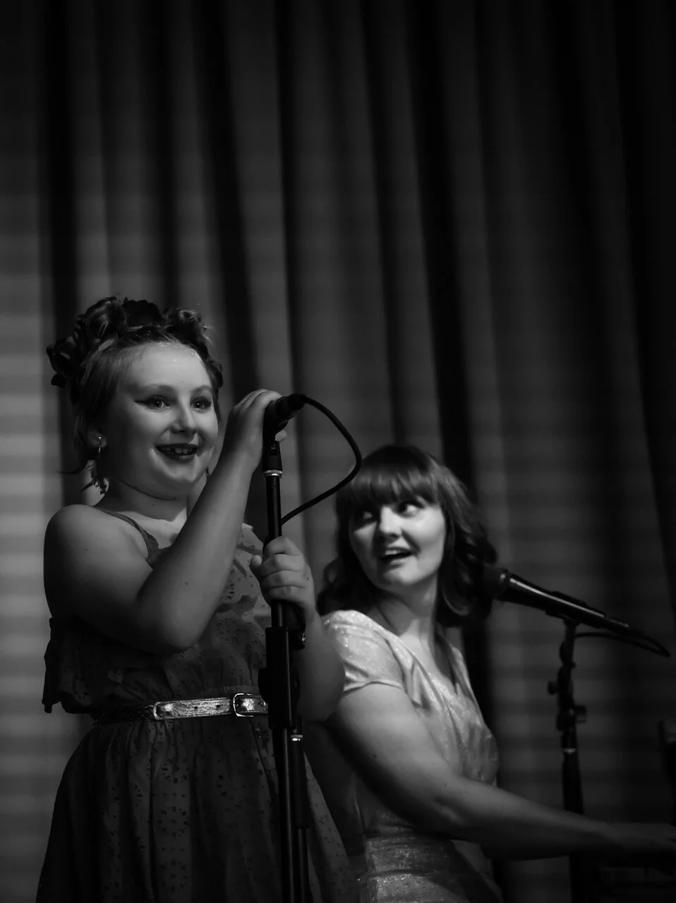 Singing a duet with her daughter.