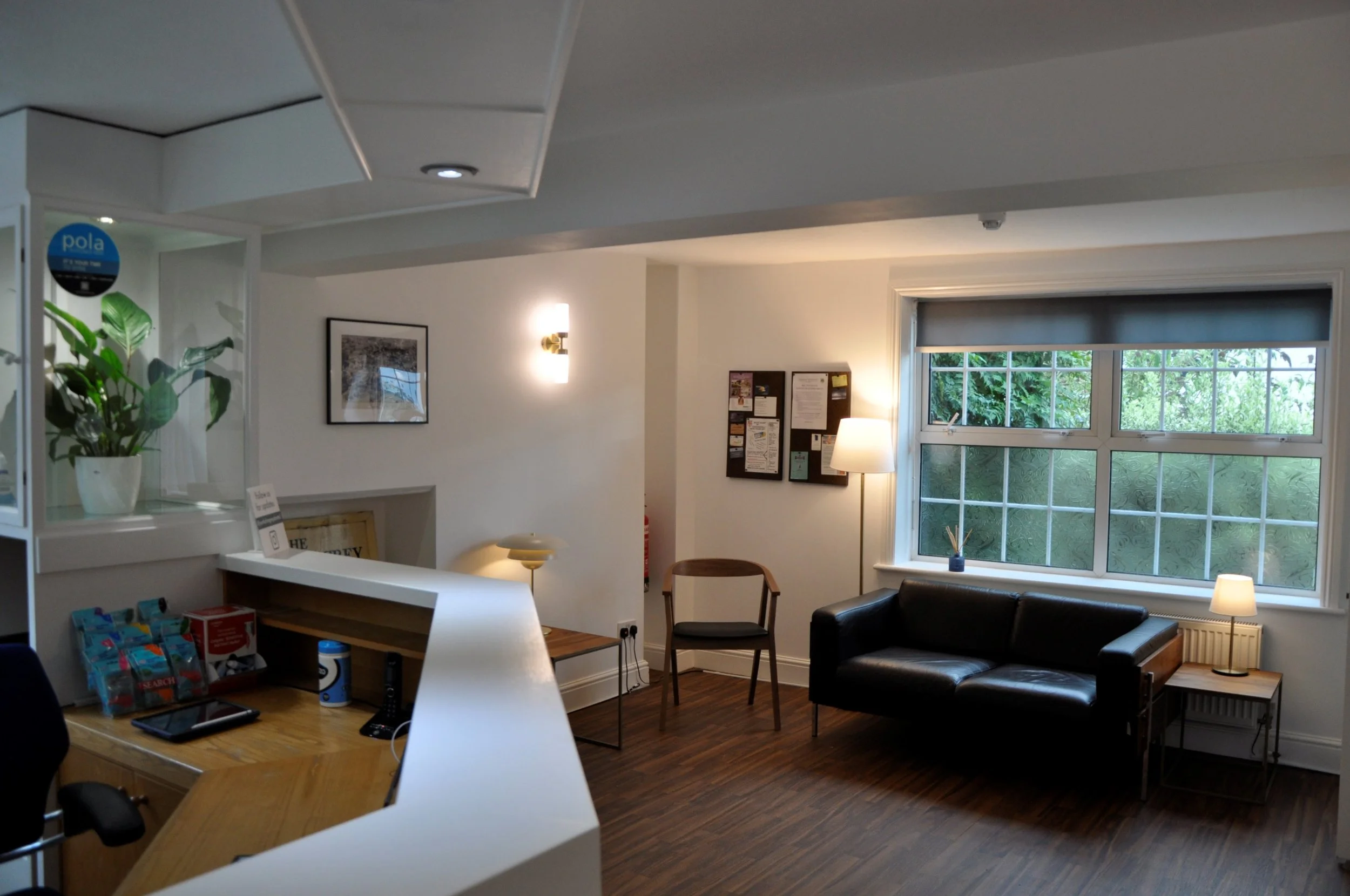 Reception and waiting room at The Yorkshire Grey, with warm lighting, plants and comfortable seating.