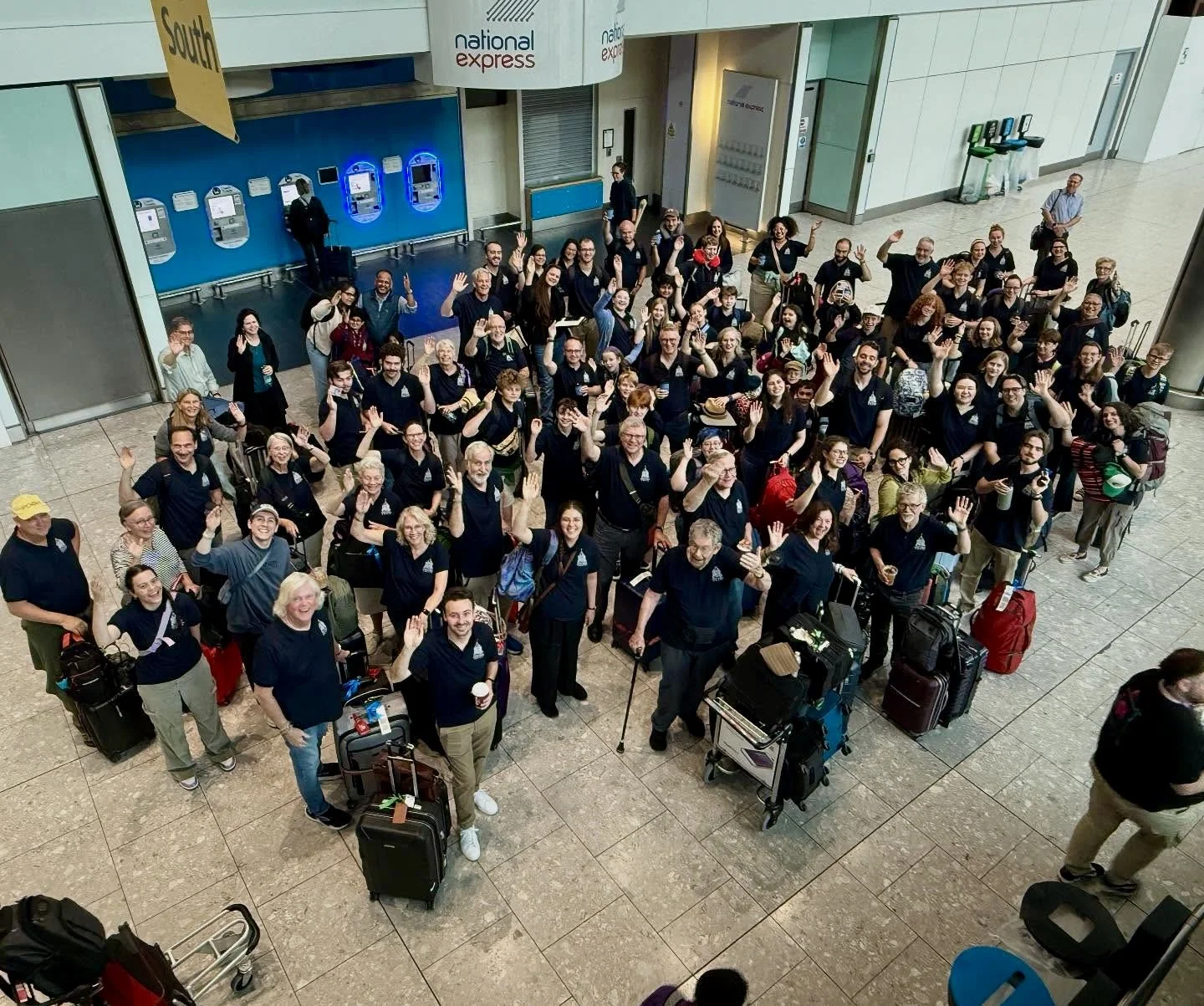The choir arrives at Heathrow