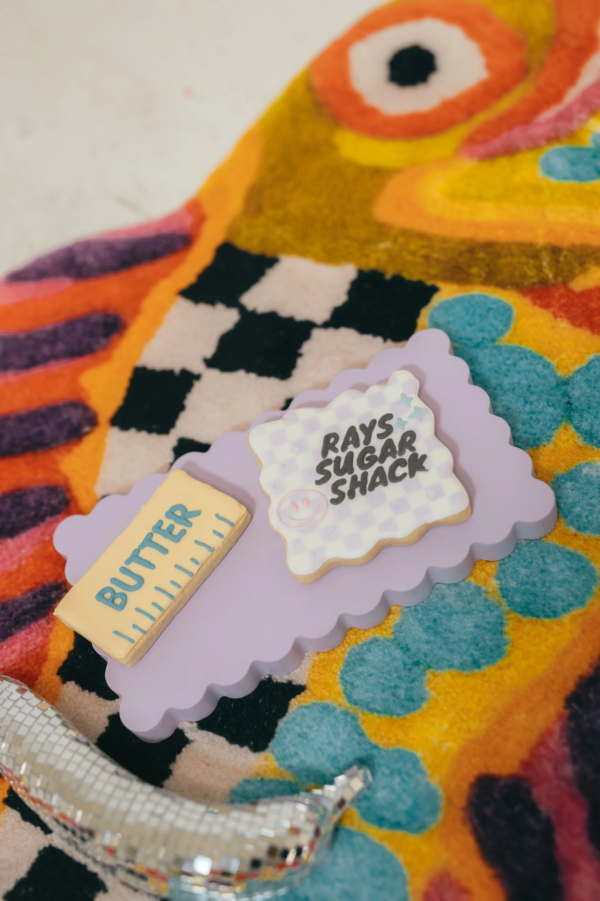 Orange County home baker posing in bright pink dress during studio branding photoshoot for cookie decorating business. Modern small business branding photography with bold color lighting and confident female entrepreneur energy. Photographed by South