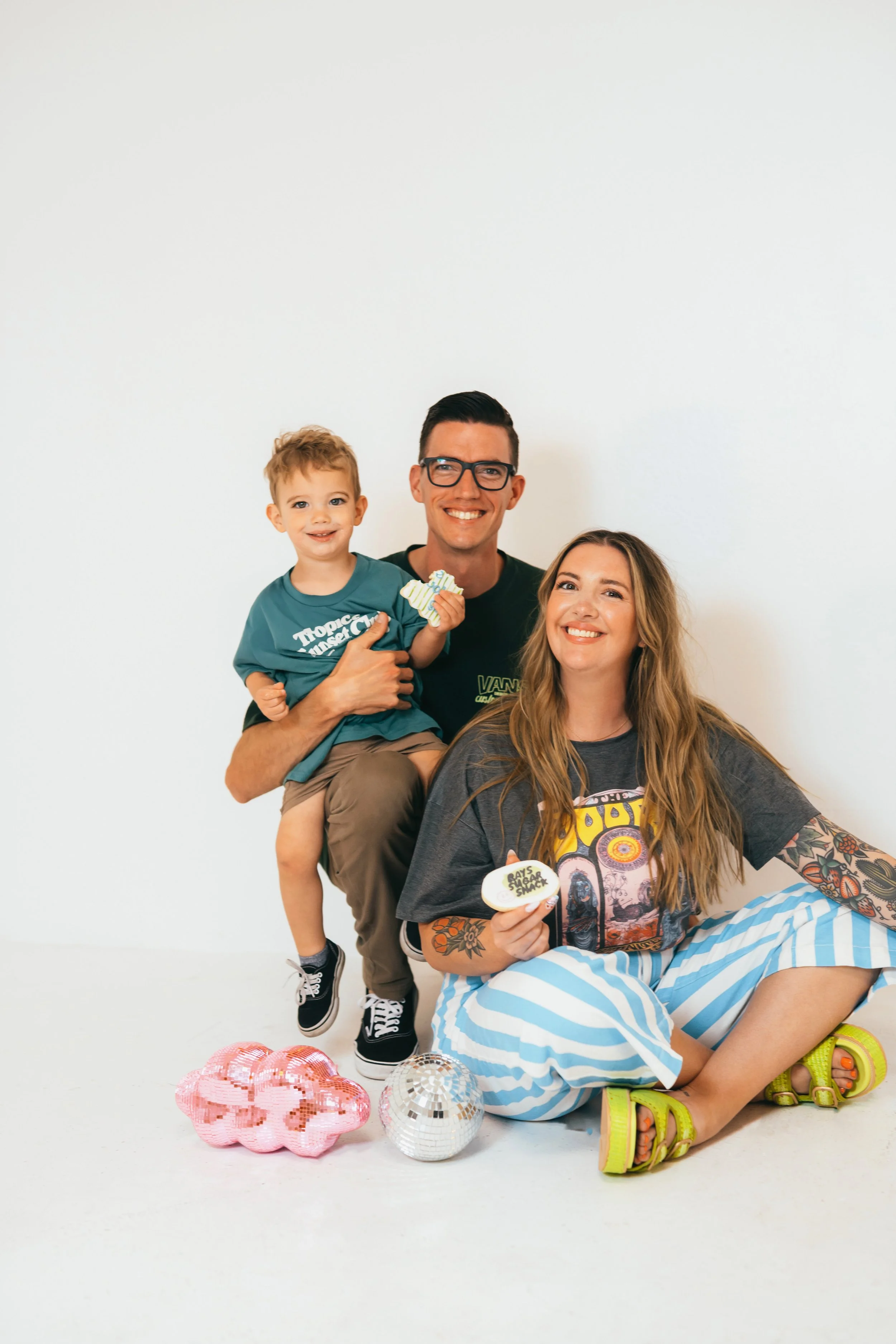 Female small business owner and cookie artist during modern branding portrait session in Southern California studio. Fun, expressive marketing photos for home baker and custom cookie decorator brand. Captured by Southern California lifestyle marketin