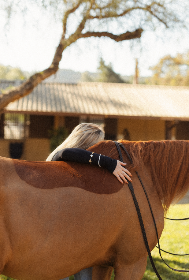 Horse girl aesthetic portrait of a Newport Beach rider embracing her horse during an equestrian photoshoot in San Marcos, California. Soft, natural light highlighting equestrian life, horse love, and authentic connection. Horse photography by Souther