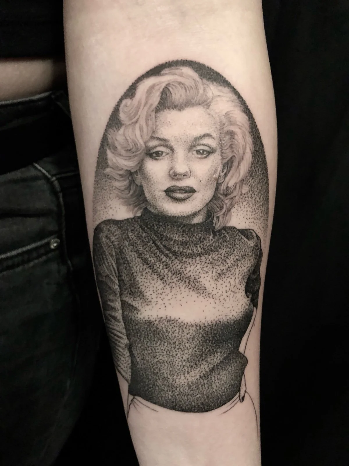 Fine line and black and grey celebrity tattoo portrait of Marilyn Monroe, created by Seattle tattoo artist Eli Bischof.