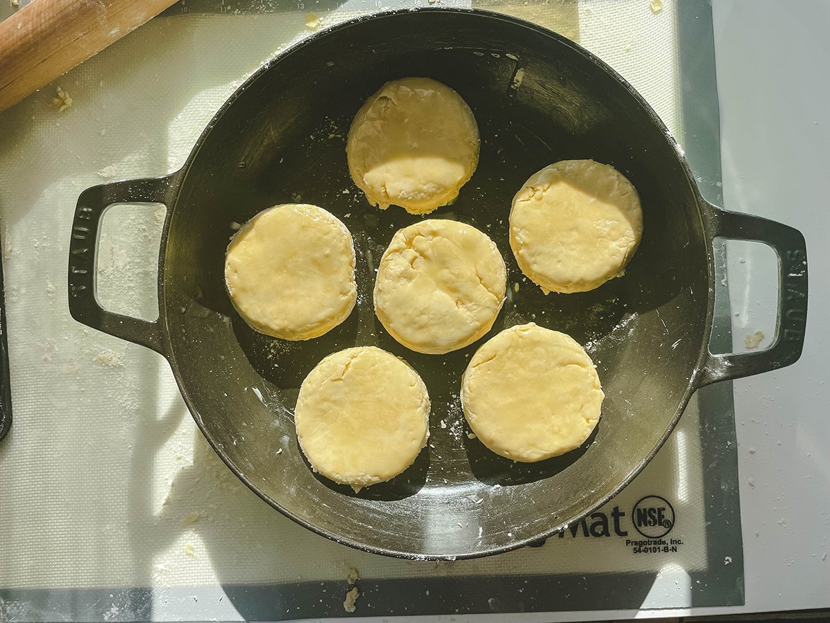 Brush melted butter over the biscuits