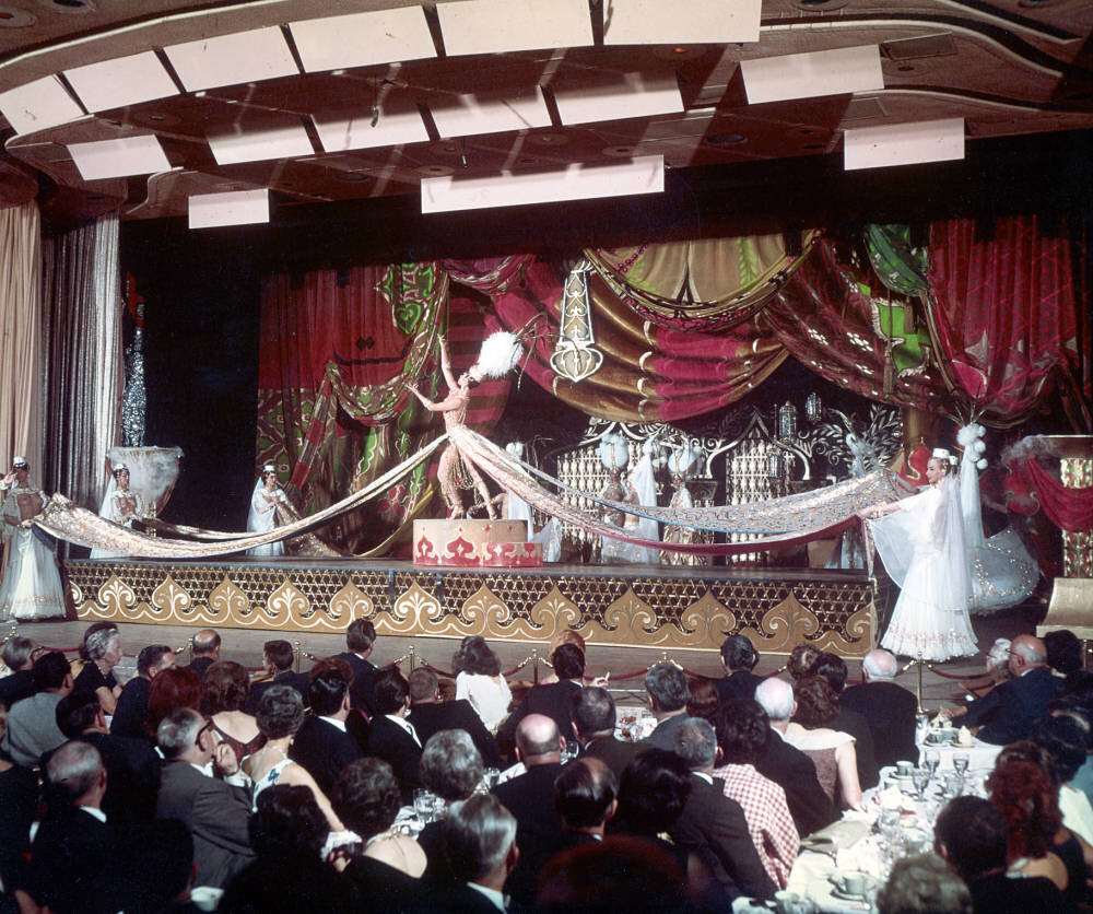  Performers in Arabian-themed scene from Lido de Paris, produced by Don Arden, at the Stardust Hotel, Las Vegas, circa early 1960s.  Donn Arden Photograph Collection, sho000207 . University of Nevada, Las Vegas Libraries. 