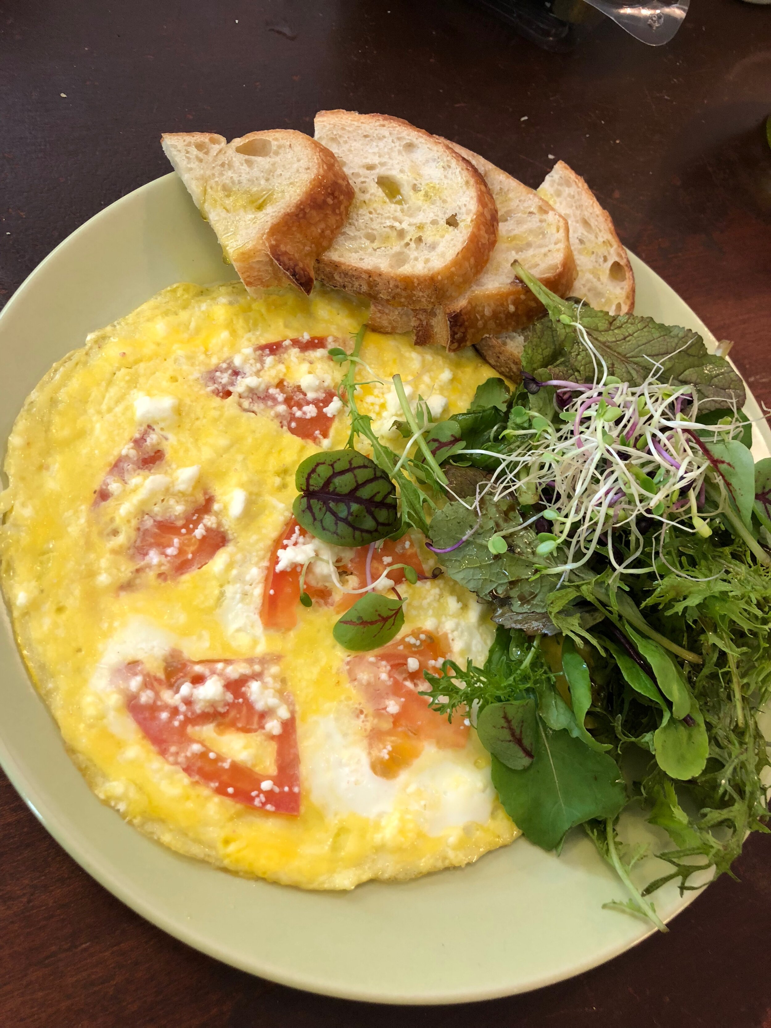 Vegetables grown at home taste soooo much better! (Leafy greens and sprouts accompany this omelet and bread.)