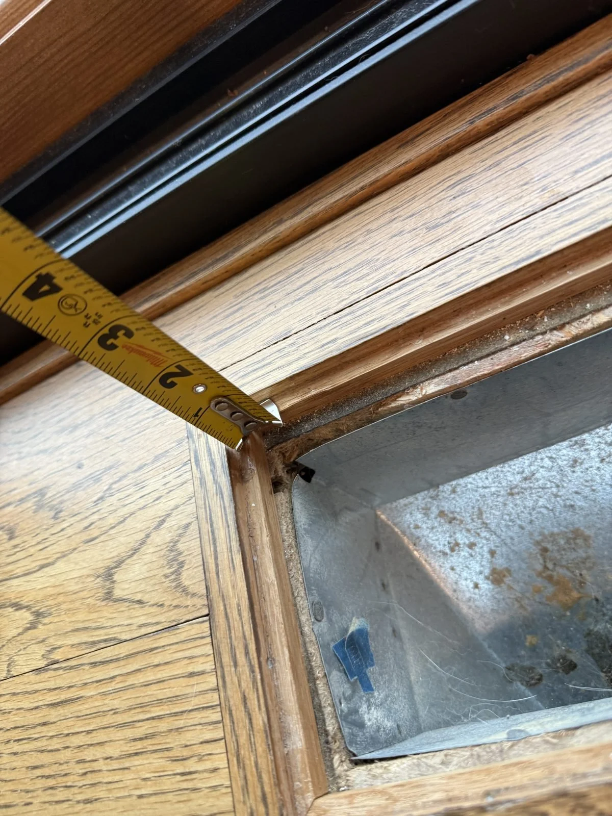Measuring the recessed wood frame around an older floor vent opening