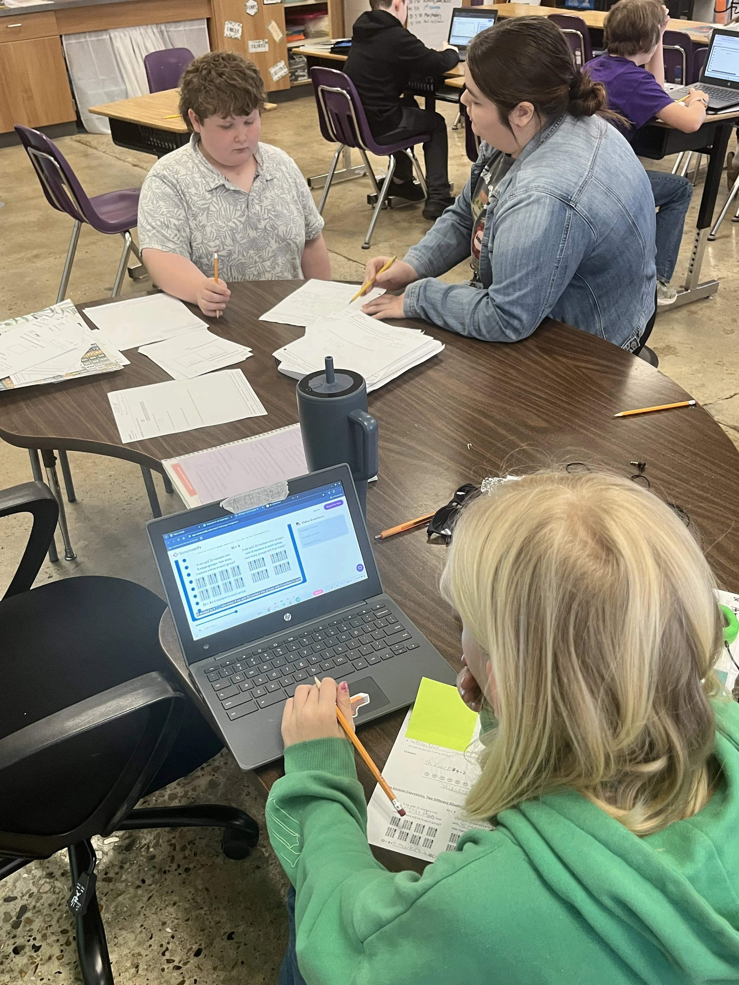 An educator supports a student with differentiated instruction.