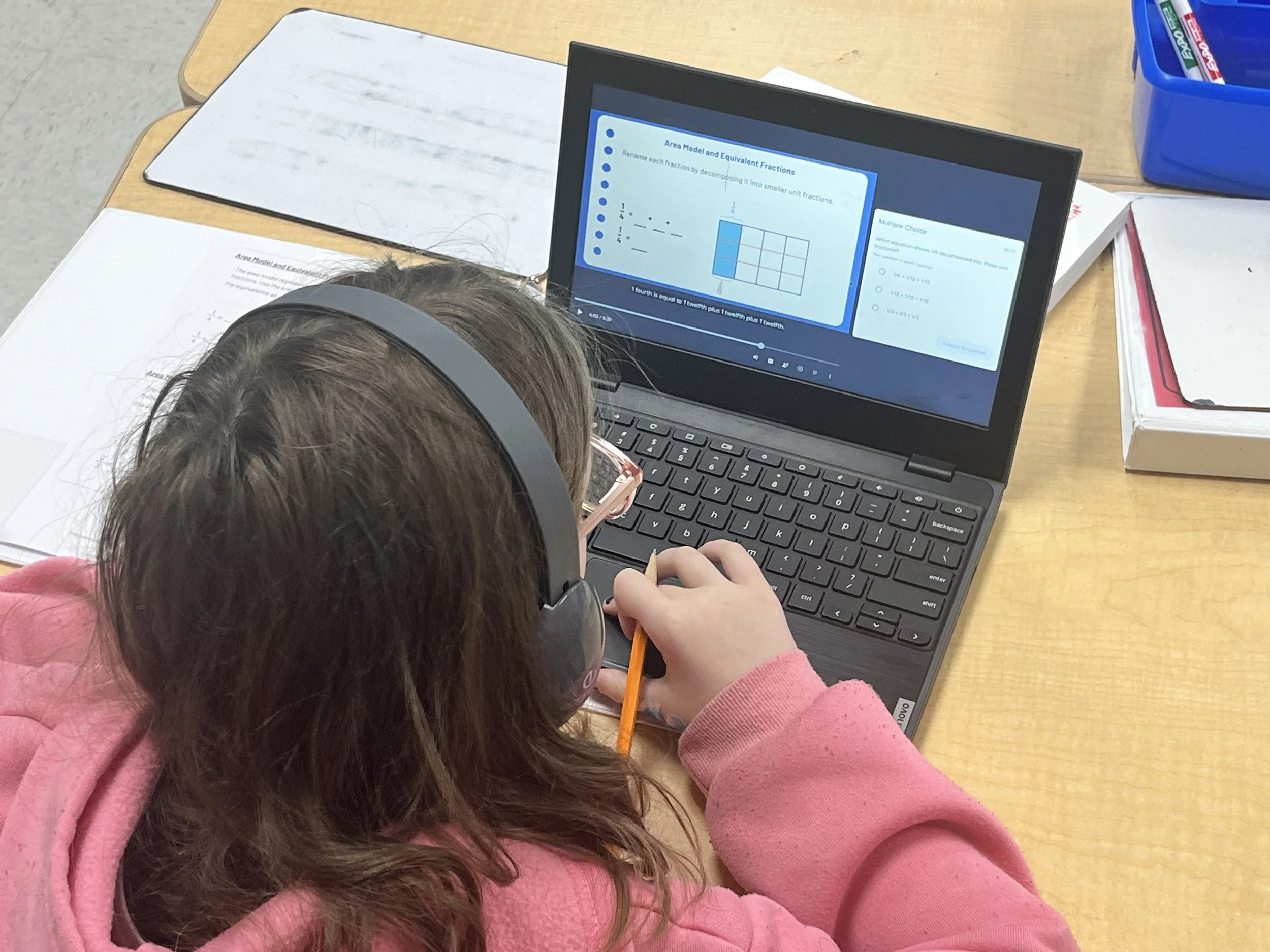 A student works independently at their computer
