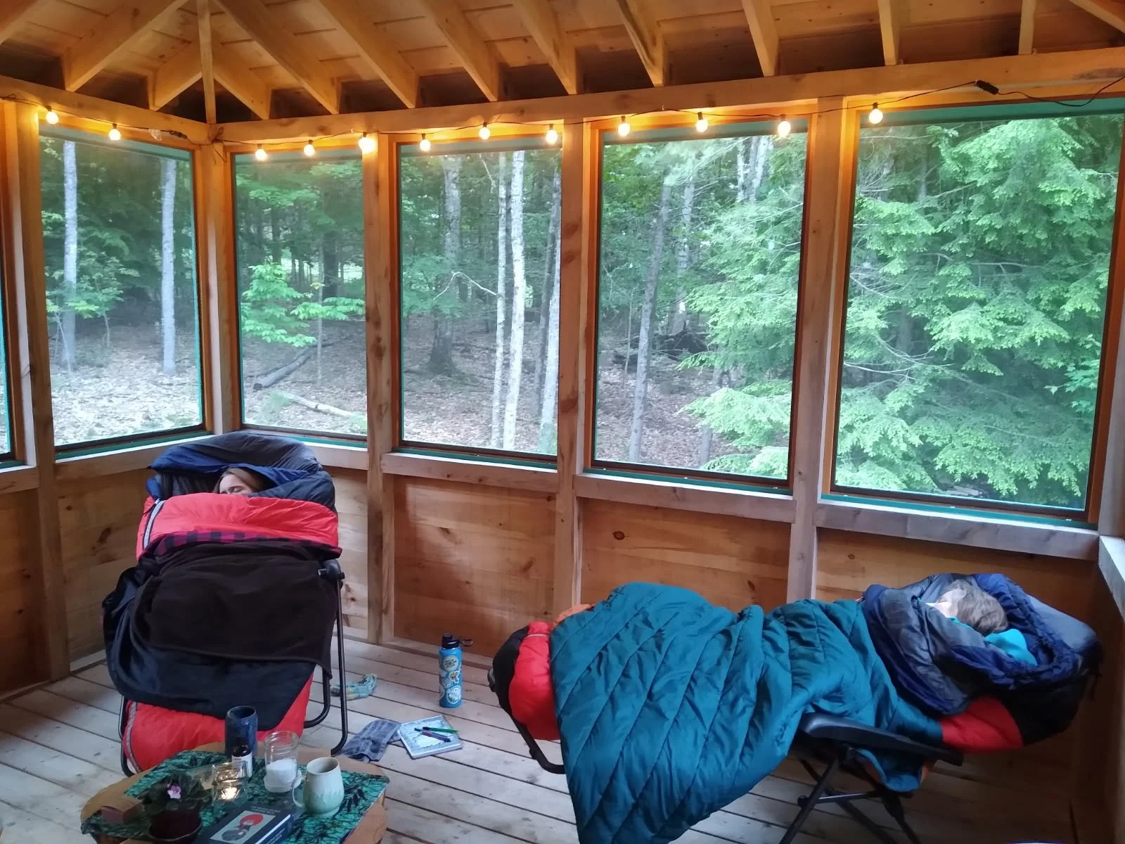 2 women napping in sleeping bags