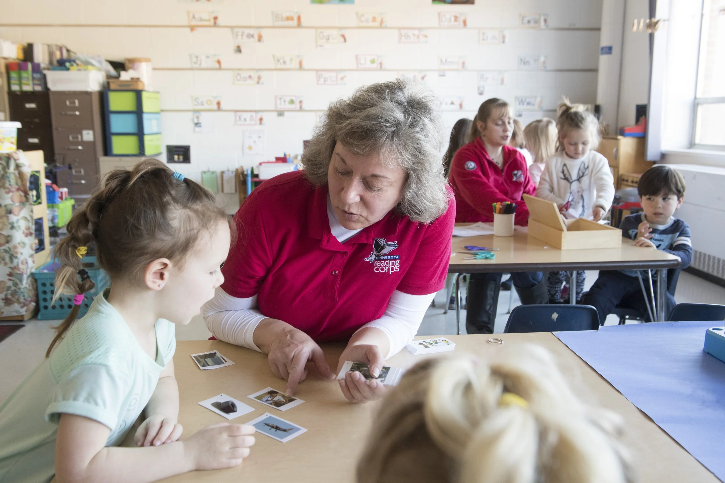 Reading tutor working with a student
