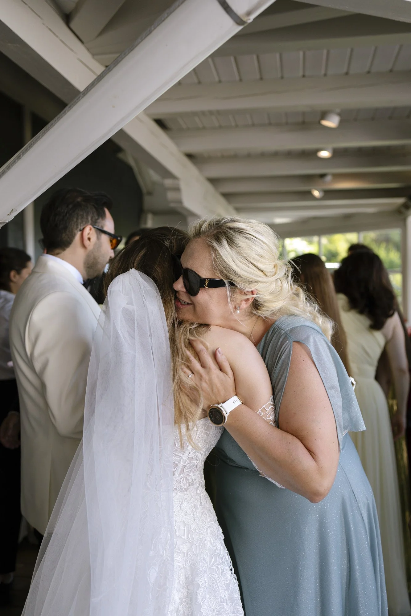 friends is hugging bride after the ceremony, fernblick wedding phtographer