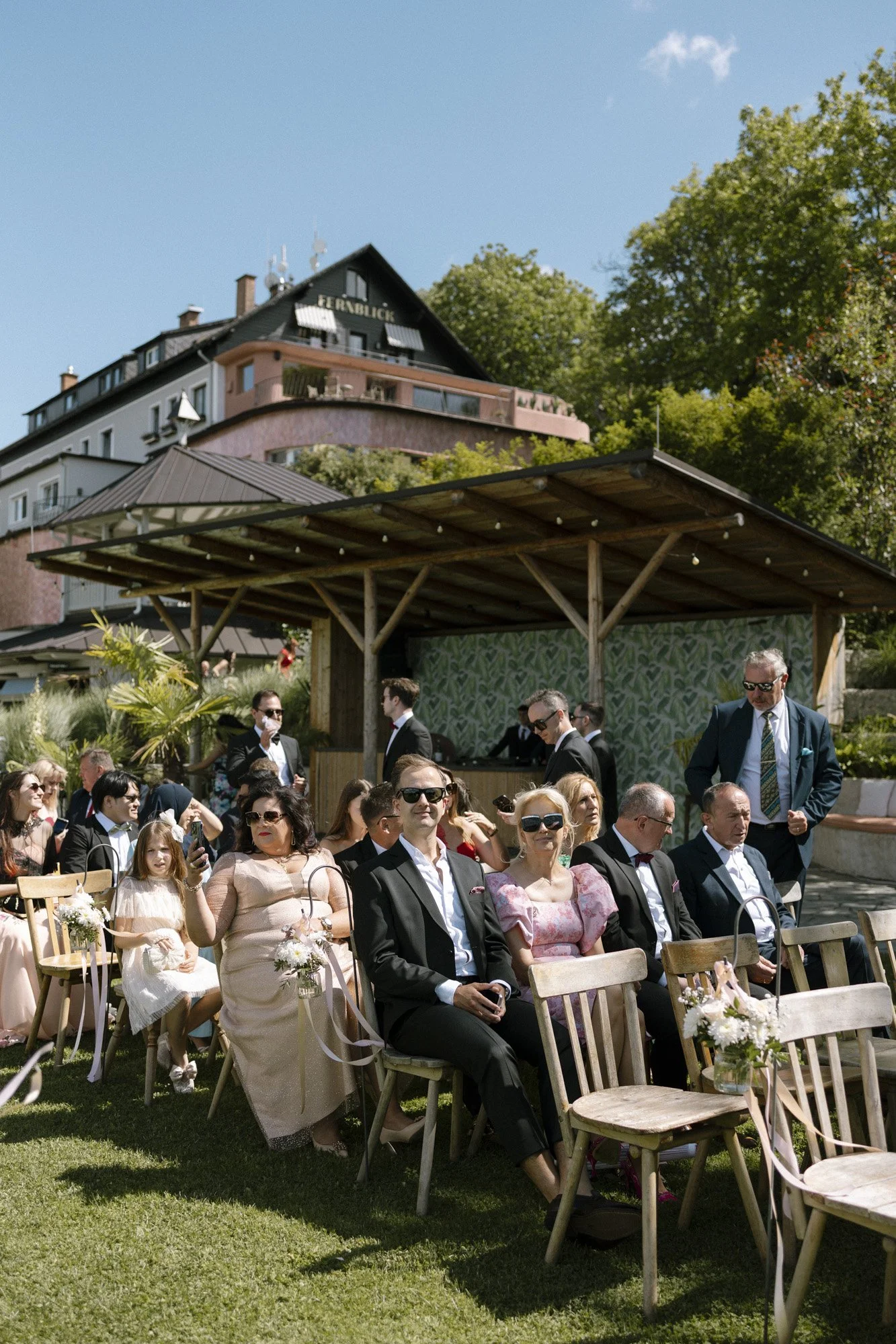 guests are sitting during the wedding ceremony at fernblick, wedding photographer