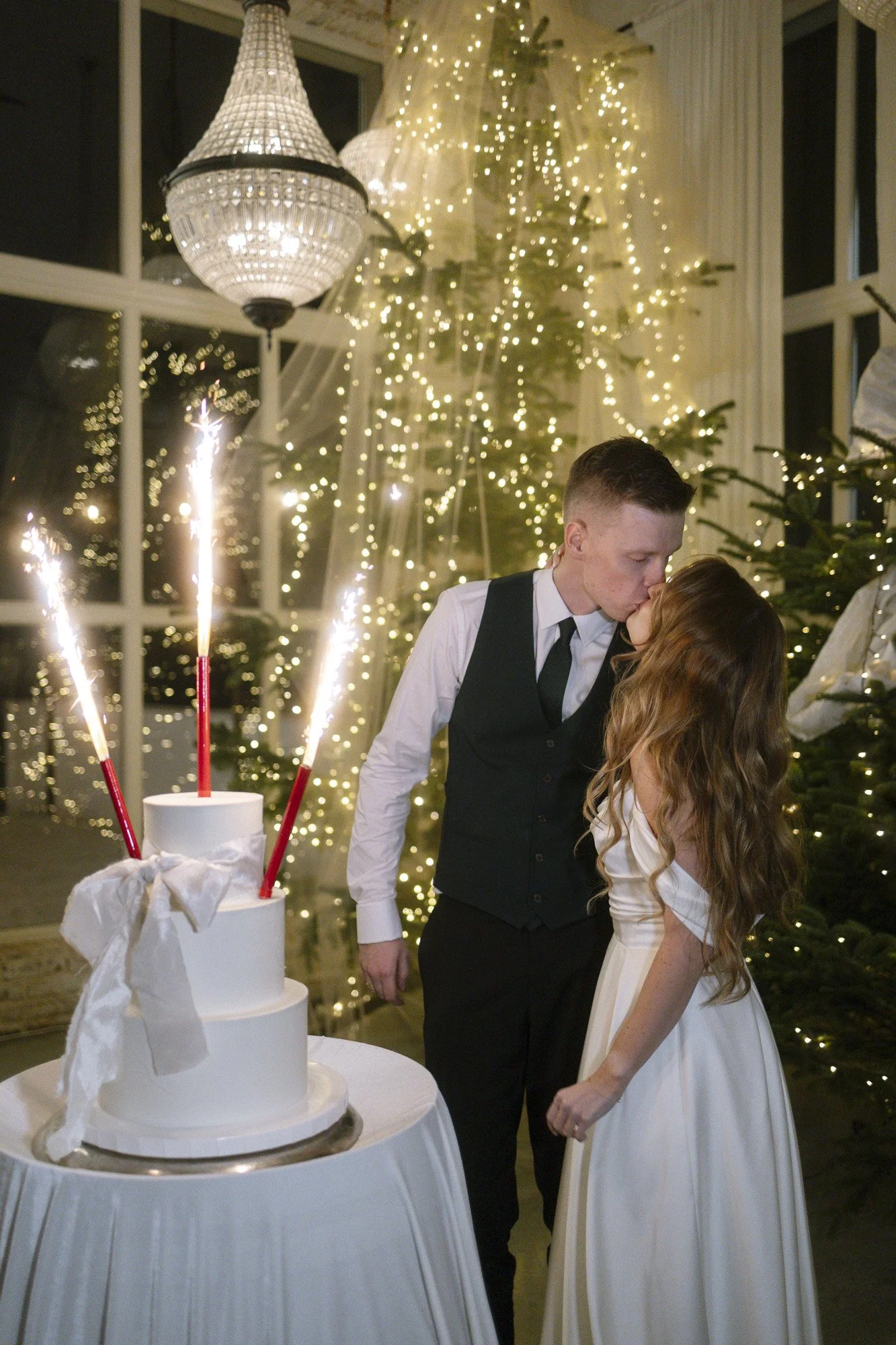 bride and groom with the wedding cake at villa love