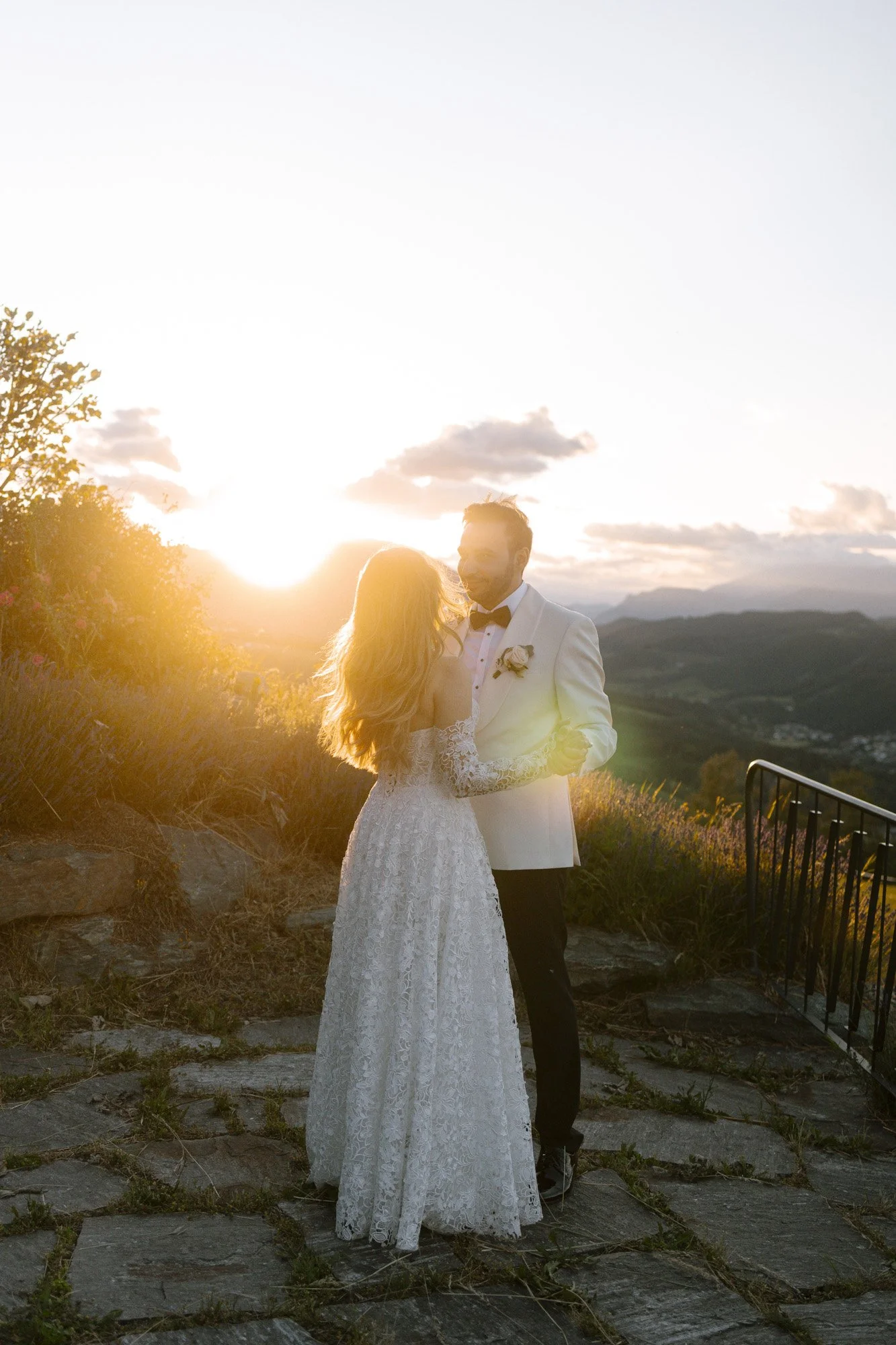 bride and groom are dancing, beautiful sunset in the background, wedding at fernblick