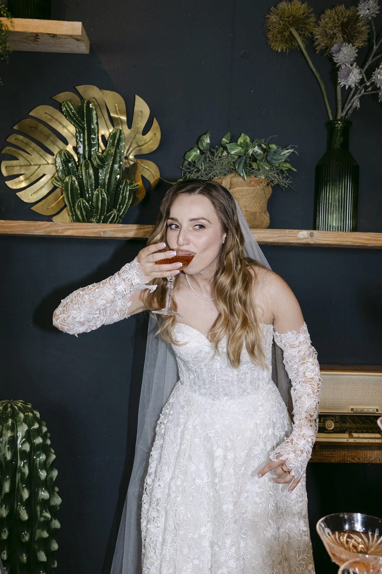 bride drinking prosecco during the wedding