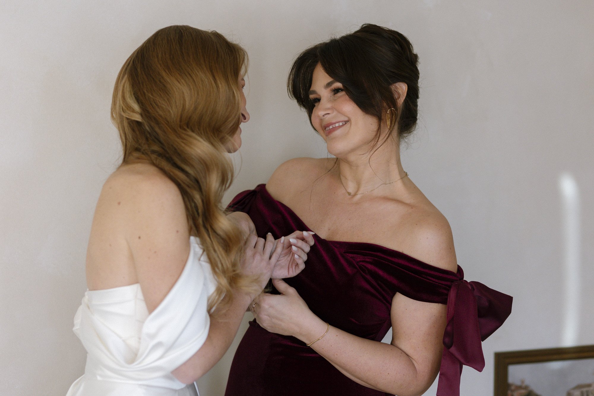 bride with her bridemaid during the wedding preparations at villa love