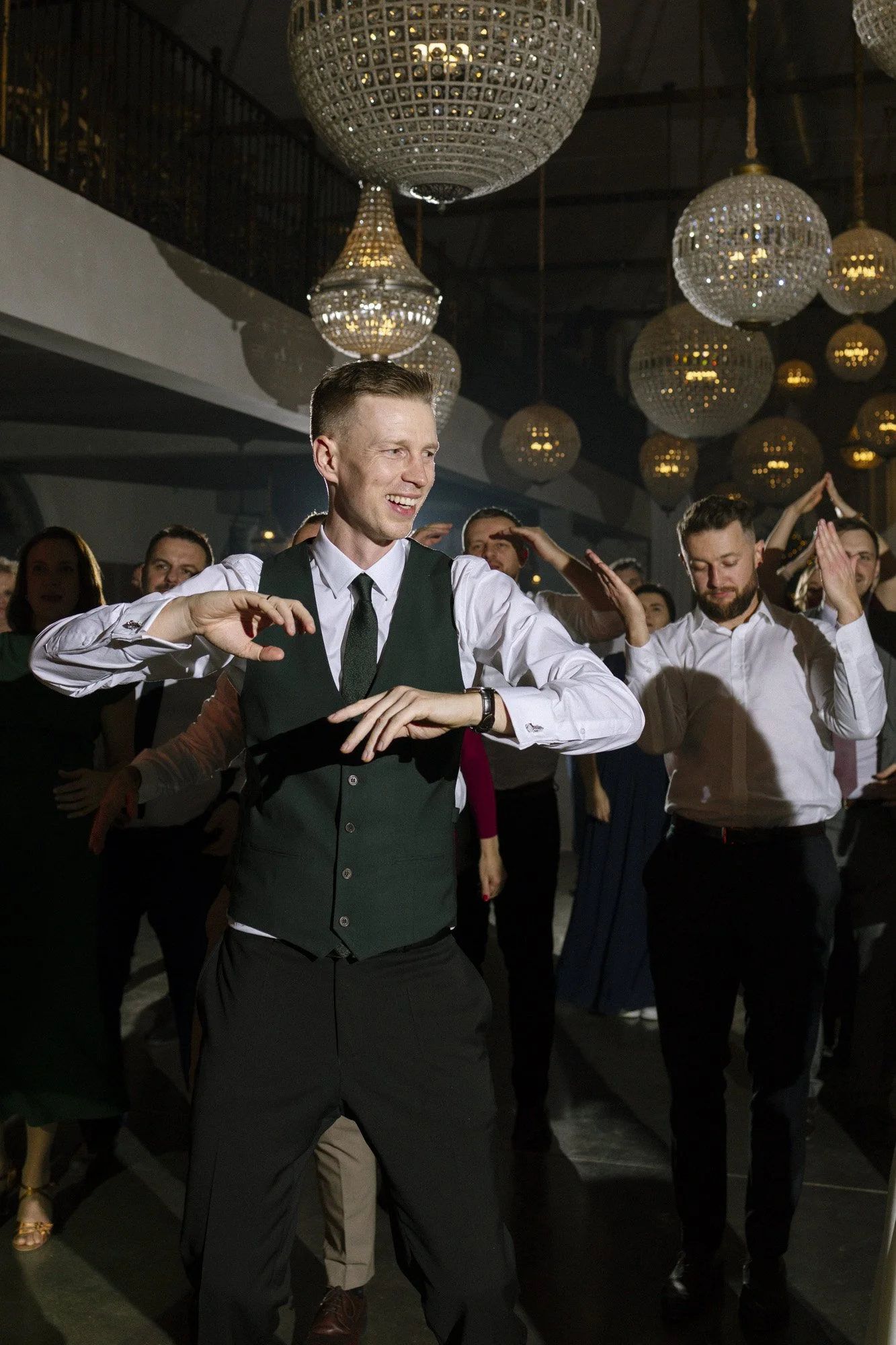 groom dancing during wedding reception at villa love