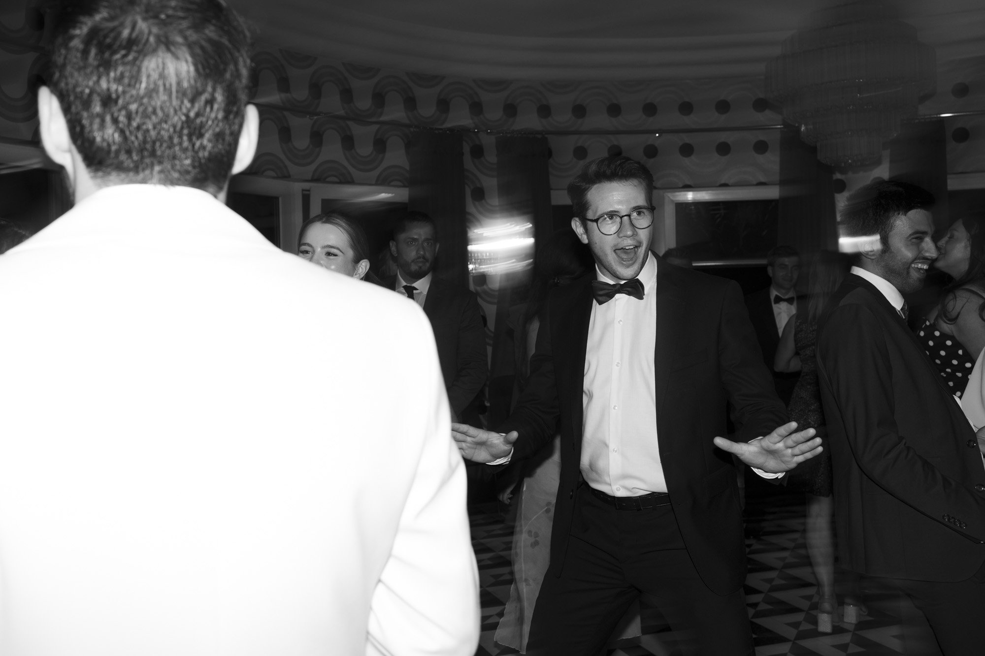 man is dancing and having fun during the wedding party at fernblick