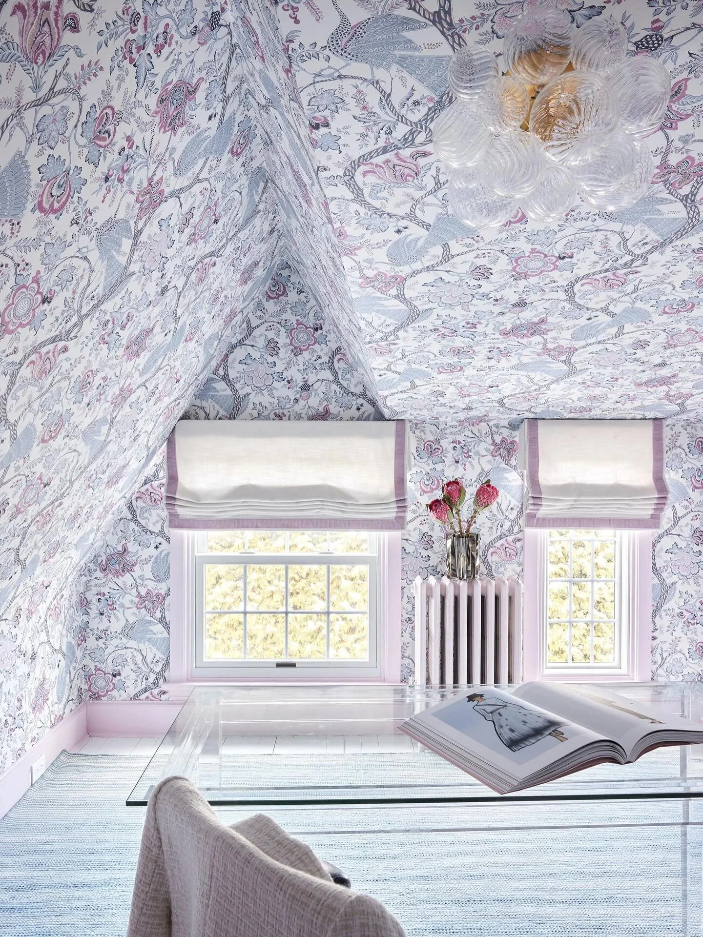 Who says a home office has to be boring? ✨ 

With its charming angles and low ceilings, this attic space could have felt cramped and flawed. Instead, we leaned in&mdash;wrapping the walls and ceiling in a bold pattern to camouflage imperfections and 