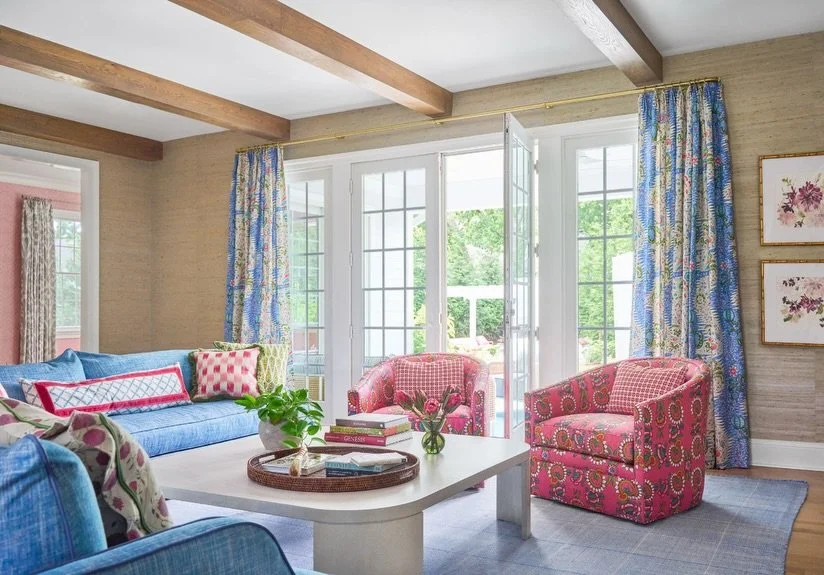 This week between Christmas and New Year&rsquo;s always feels like one long, cozy blur. Is it Monday? Saturday? Who knows. All I know is this room understands the assignment.

A crisp blue sofa you can actually sprawl on, a pair of pink patterned cha