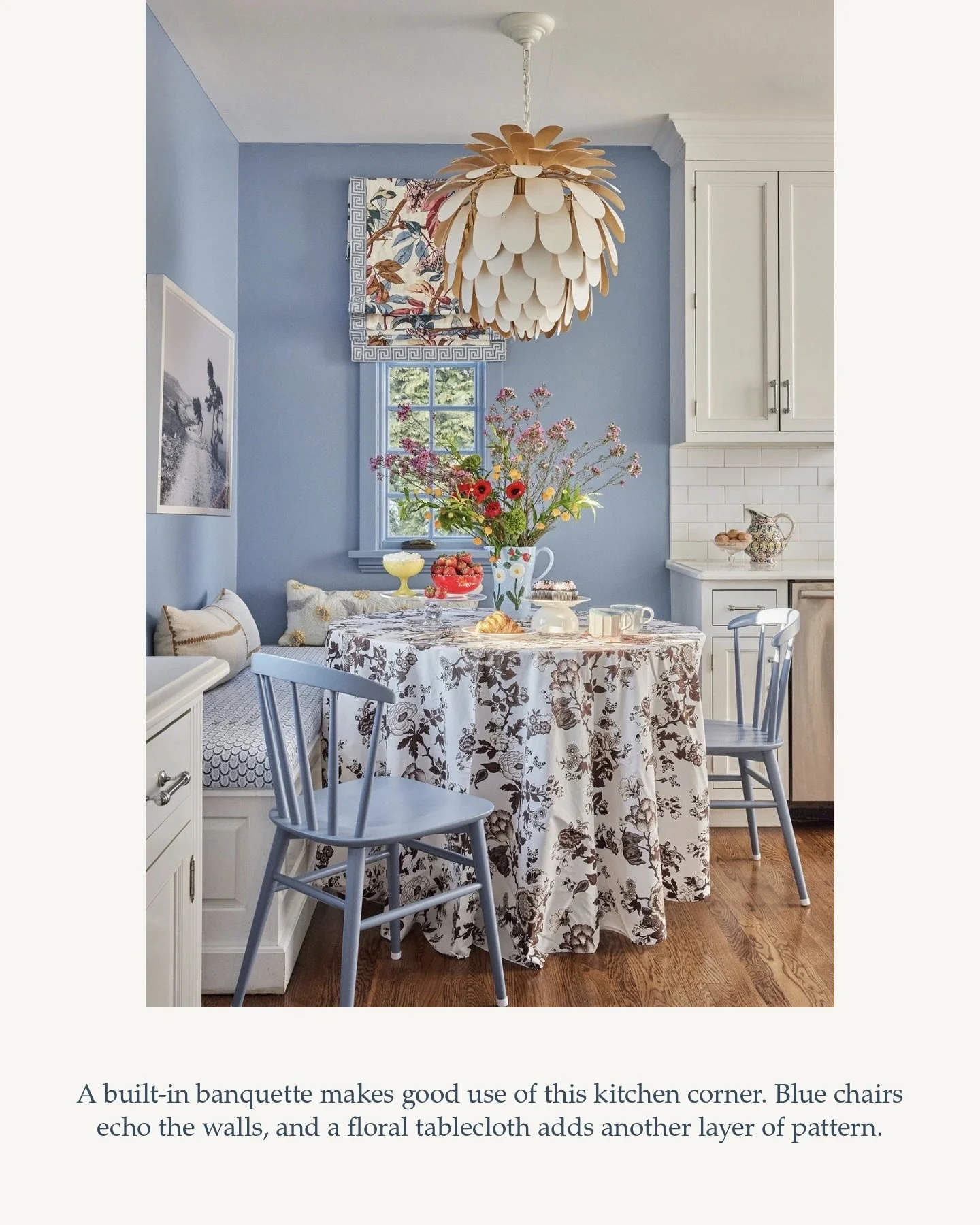 I saw this kitchen&rsquo;s potential the moment my clients first brought me through. We recovered the banquette, painted the walls, trim and mullions the prettiest blue, and dressed the windows in a fabulous floral edged with Greek key trim. Swapped 