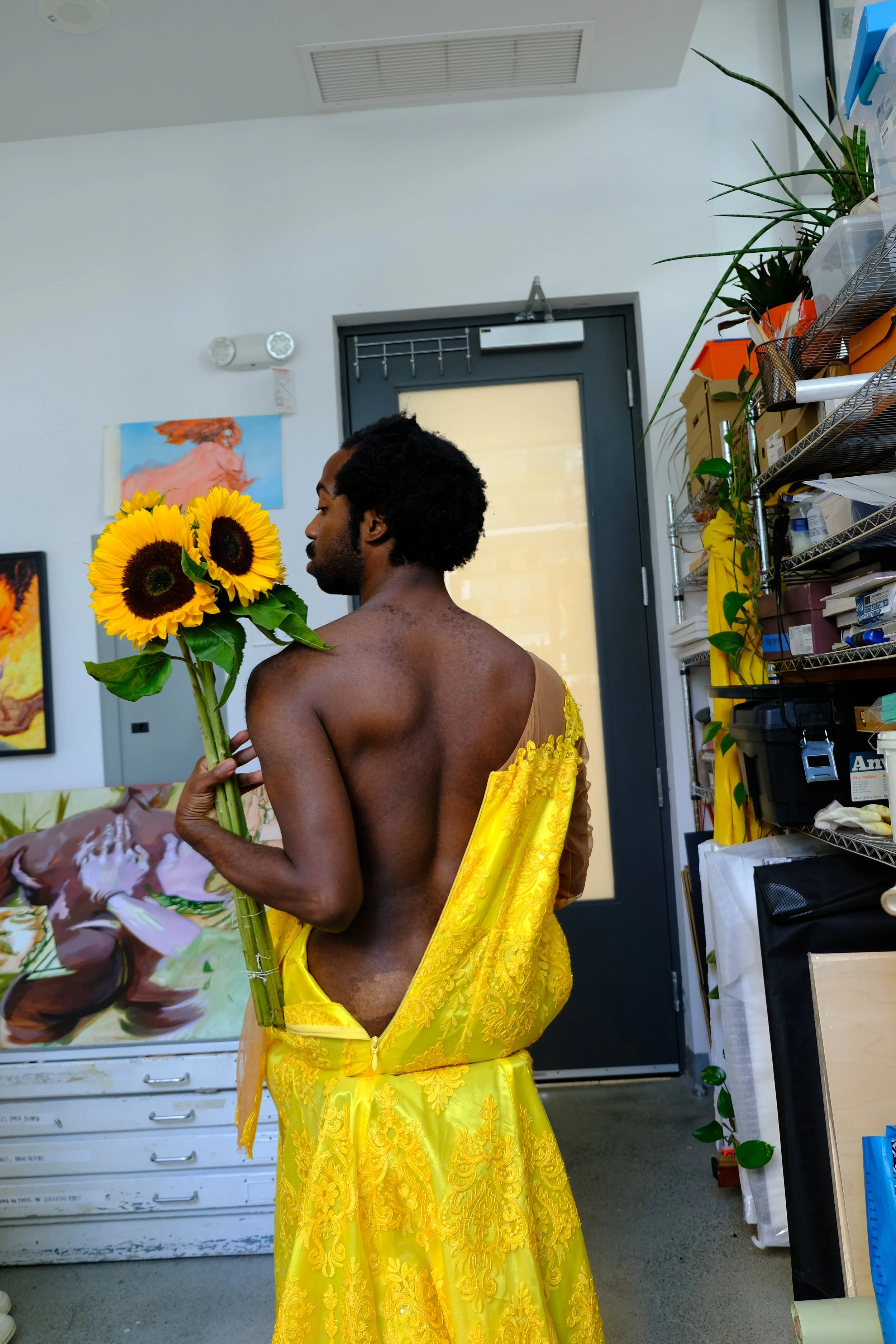 Using this floral yellow dress as a potential look that plays with form, drapery, color, and a contrast of small details and longer forms