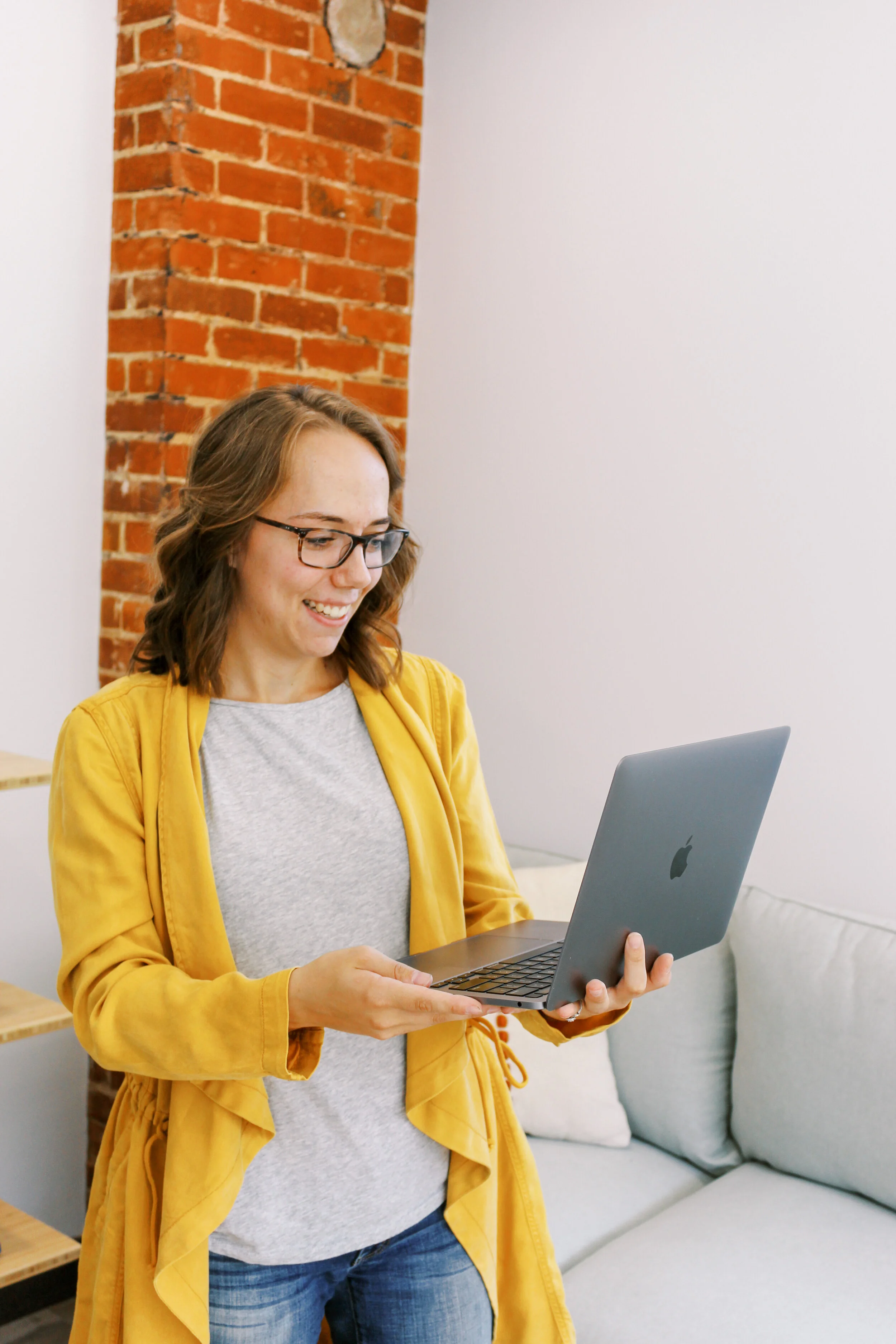 Elizabeth, Founder of Brightened Season, Working on a Laptop