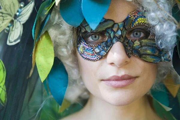 I made this mask using Swarovski crystals and leather that I hand painted.